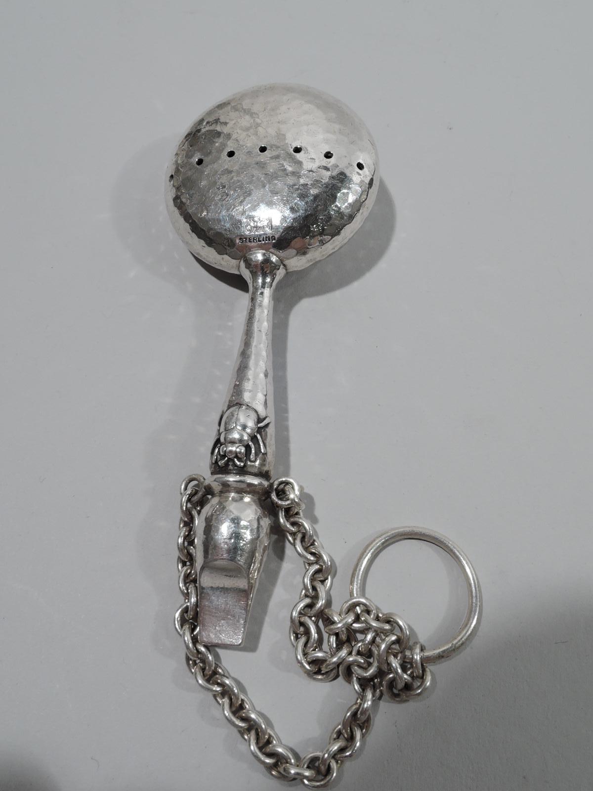 Rare Japonesque hand-hammered sterling silver baby rattle. Made by Whiting in New York, ca 1885. Flat and round head with double sided piercing with applied flower head and beetle on front. Baluster handle with second beetle and whistle terminal.