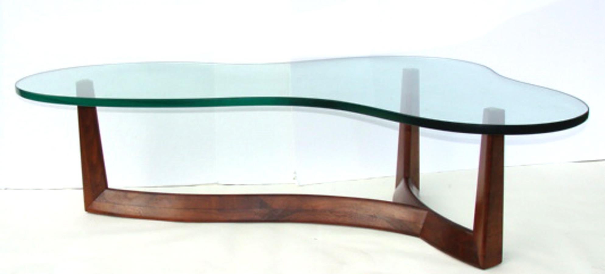Newly discovered glass-top coffee table in the manner of Robsjohn- Gibbings.
Attributed to the John Widdicomb Co. (not Widdicomb Furniture). Although both firms were located in Grand Rapids, they were competing manufacturers. This table is likely