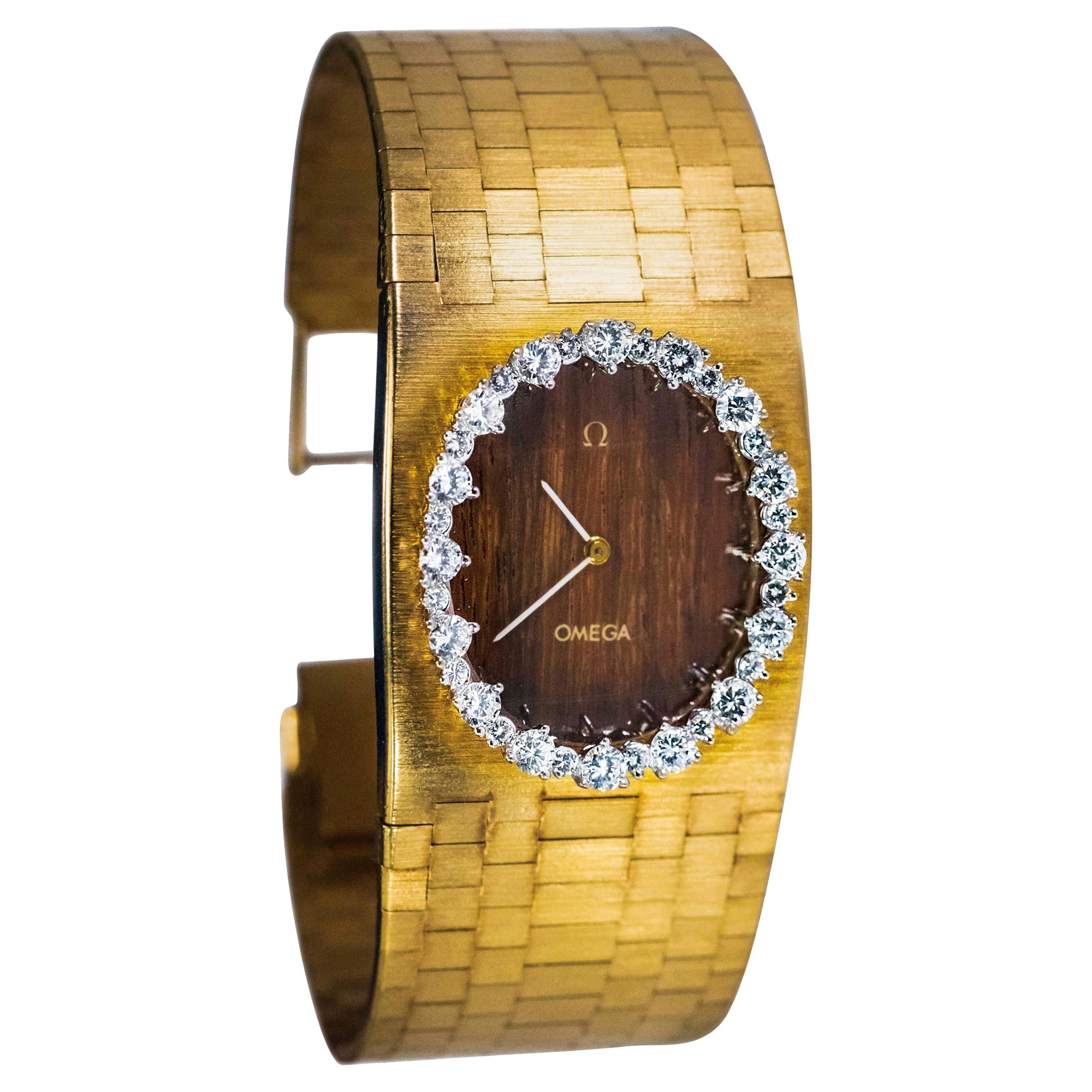 1970s Wide Omega Diamond Teak Wood Dial 18 Karat Yellow Gold Bangle Cuff Watch For Sale