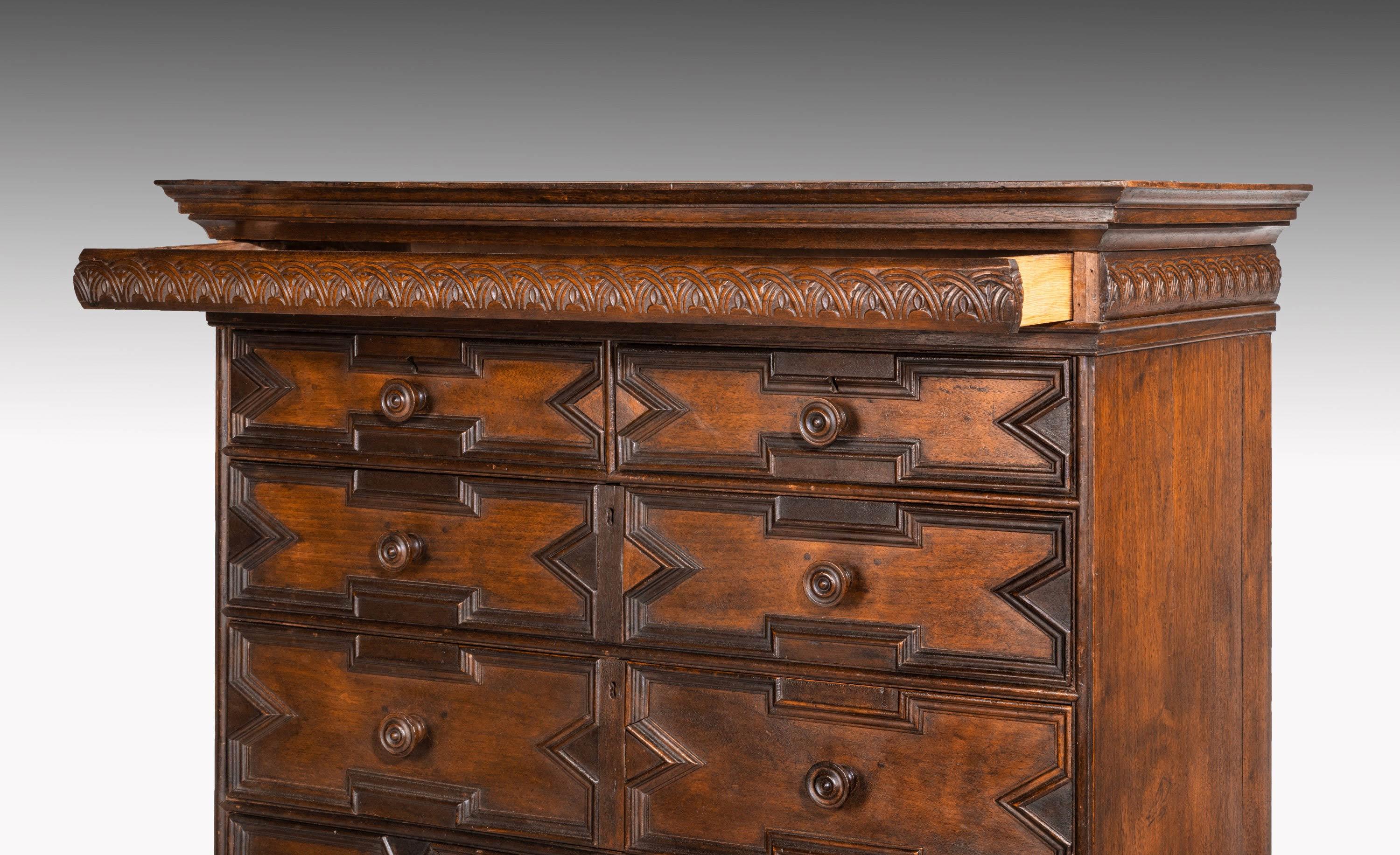 A rare William and Mary period solid walnut chest on original stand. With one minor restoration to one of the stretchers. It is most unusual to find something of this date not married. Good overall patina.
 