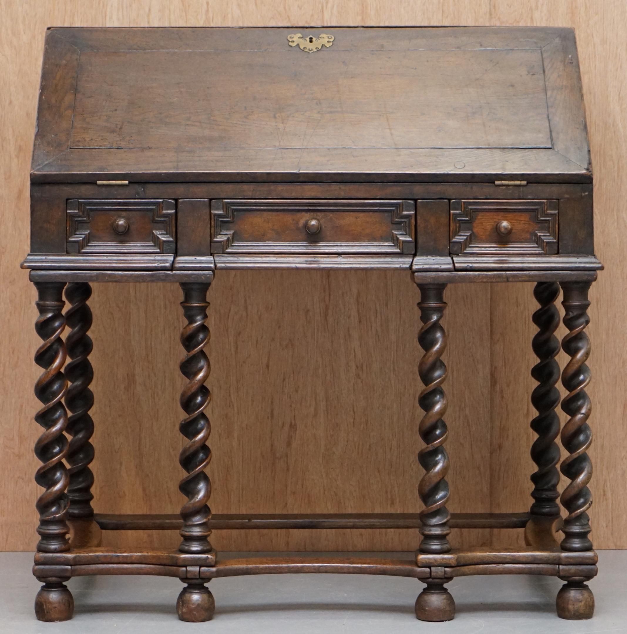 We are delighted to offer for sale this exceptionally rare original William & Mary 1690 barley twist drop front bureau desk on stand in solid English oak

A solid oak barley twist gate leg bureau on stand of lovely color. Late 17th century,