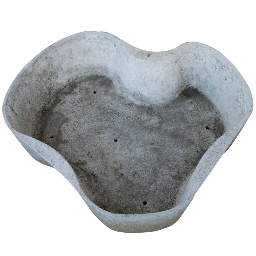 Three unique shaped Eternit planters available individually or separately. These modern art planters from visionary Willy Guhl are appreciated best indoors in a home or professional setting. The cool grey, wavy body has a patina of age and wear that