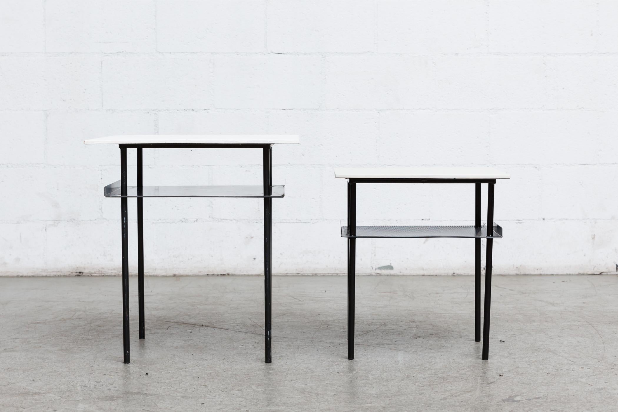 Rare Wim Rietveld side table with painted White plywood top, enameled black metal legs and sheet metal lower shelf with bent up edges. Original condition. Shown with its smaller version, listed separately.