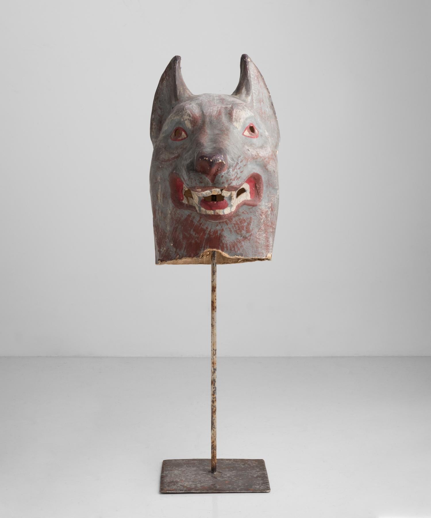 Rare wolf theatre mask, Belgium, circa 1930

hand painted papier mache in original condition with metal stand.

16