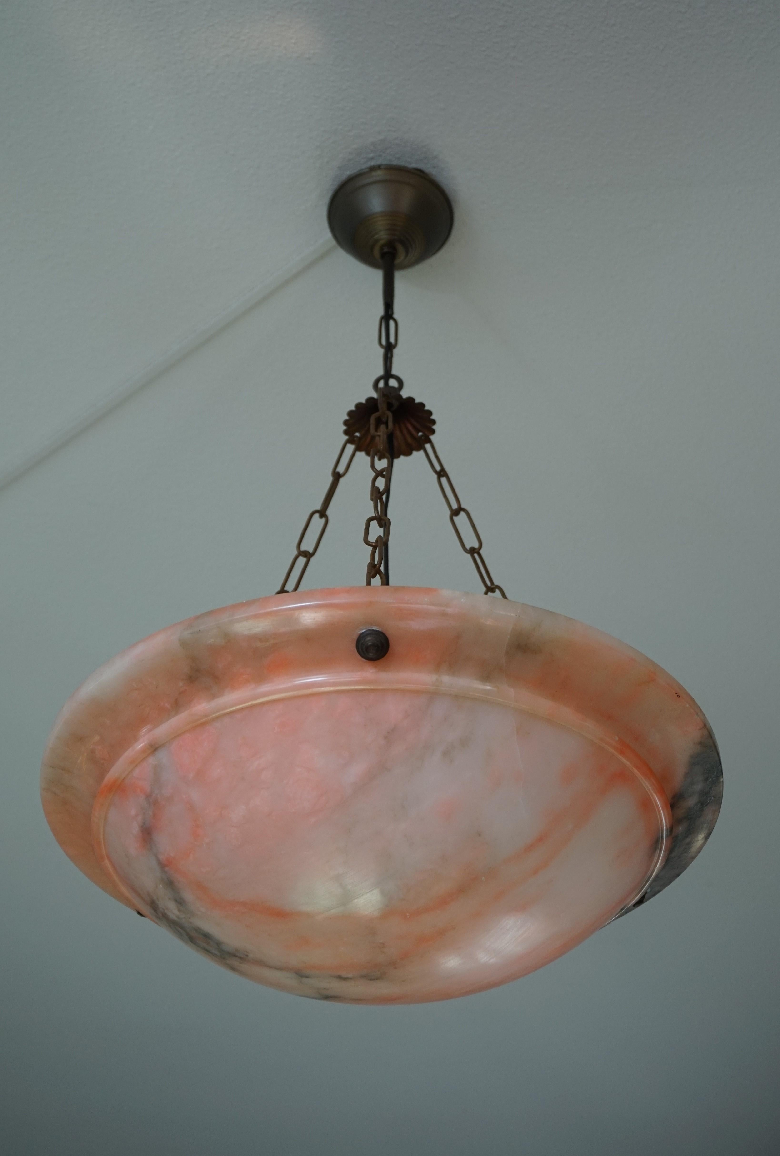 Good size and striking color Art Deco light fixture from the 1920s.

This remarkable pendant dates from the heydays of the French Art Deco era and apart from one minor chip to the rim it could not be in a better condition. The sleek design and the