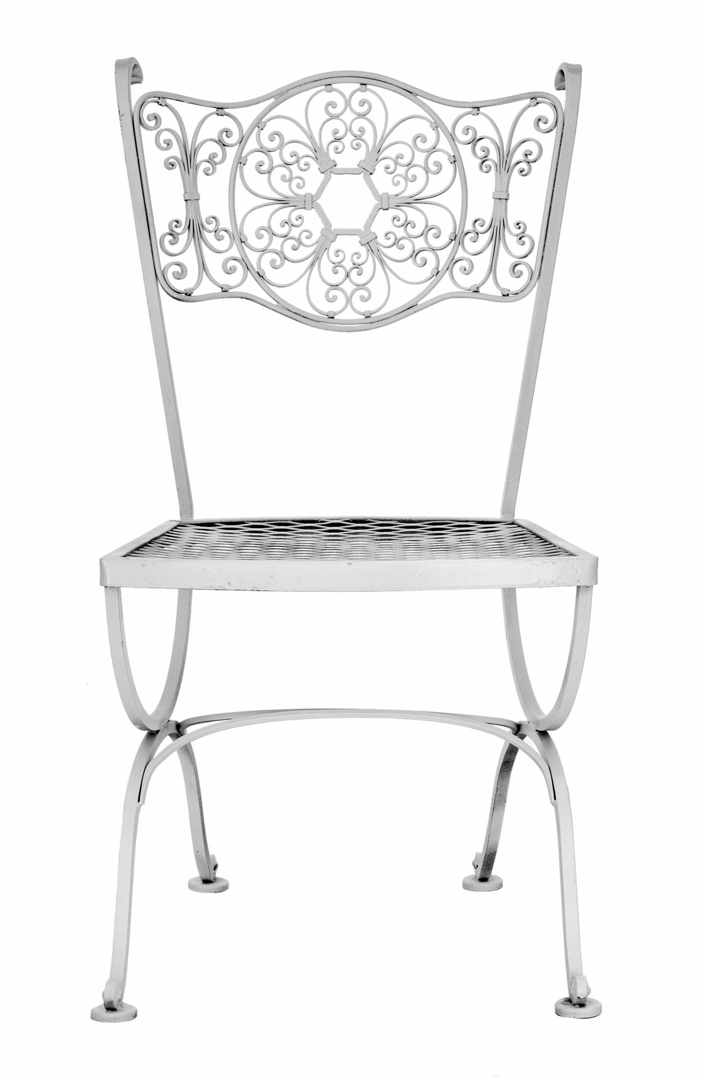 A rare set of five wrought iron chairs from the Andalusian collection by Woodard.
