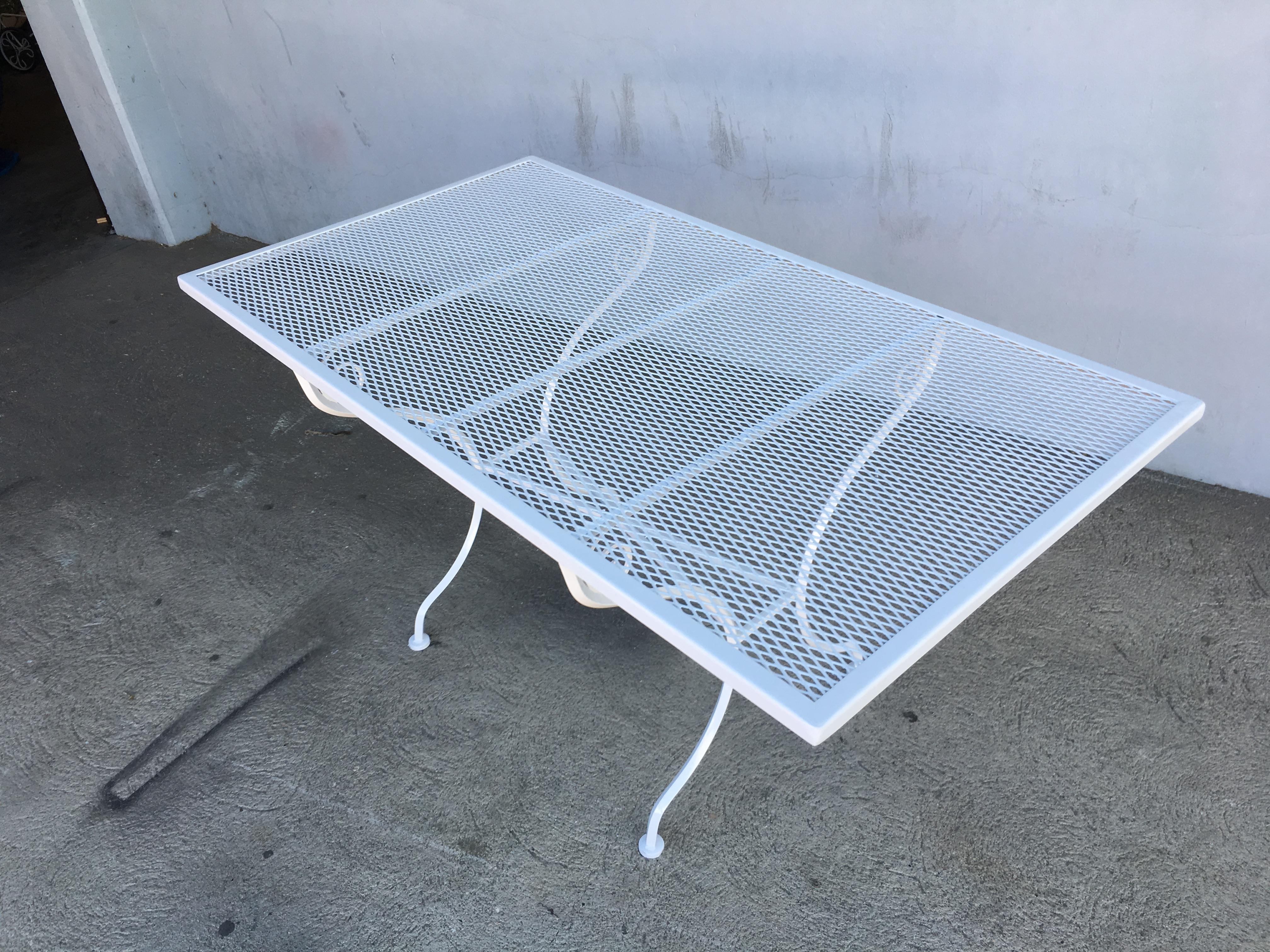 Rare midcentury mesh steel picnic table with scrolling legs by the Woodard company. Woodard chairs to accompany this table are available in store, circa 1950 by Woodard