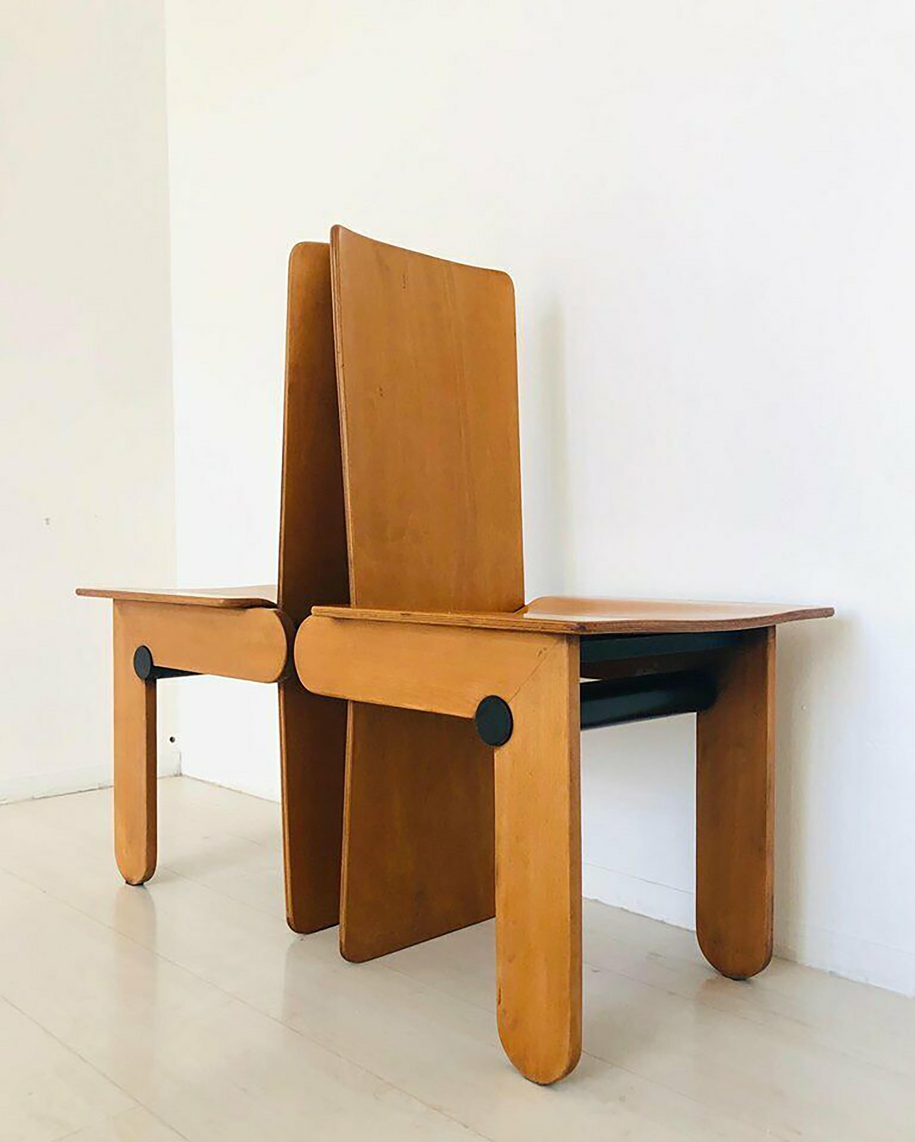 This is a beautiful rare set of four chairs designed by Carlo Scarpa and realized by the Italian Company Gavina in the 1970s.

These Postmodern chairs are made of a wooden structure in light brown.

The attribution to Carlo Scarpa is due to