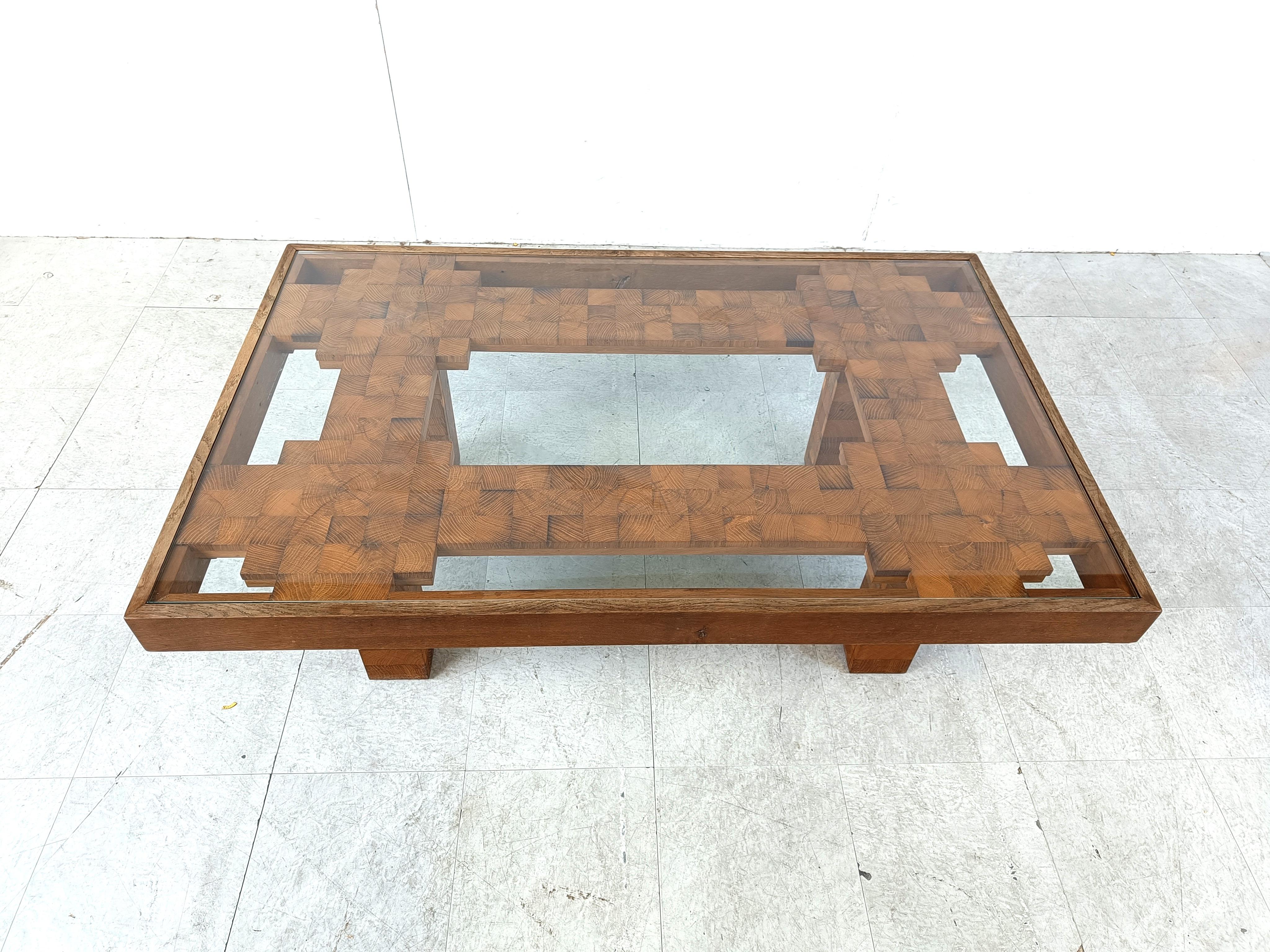 Very rare mid century mosaic coffee table witha rectangular clear glass top. 

Beautifully crafted coffee table with a timeless architectural design.

Gorgeous natural wooden veins troughout.

1960s - Belgium

Height: 44cm
Width: 134cm
Lenght: