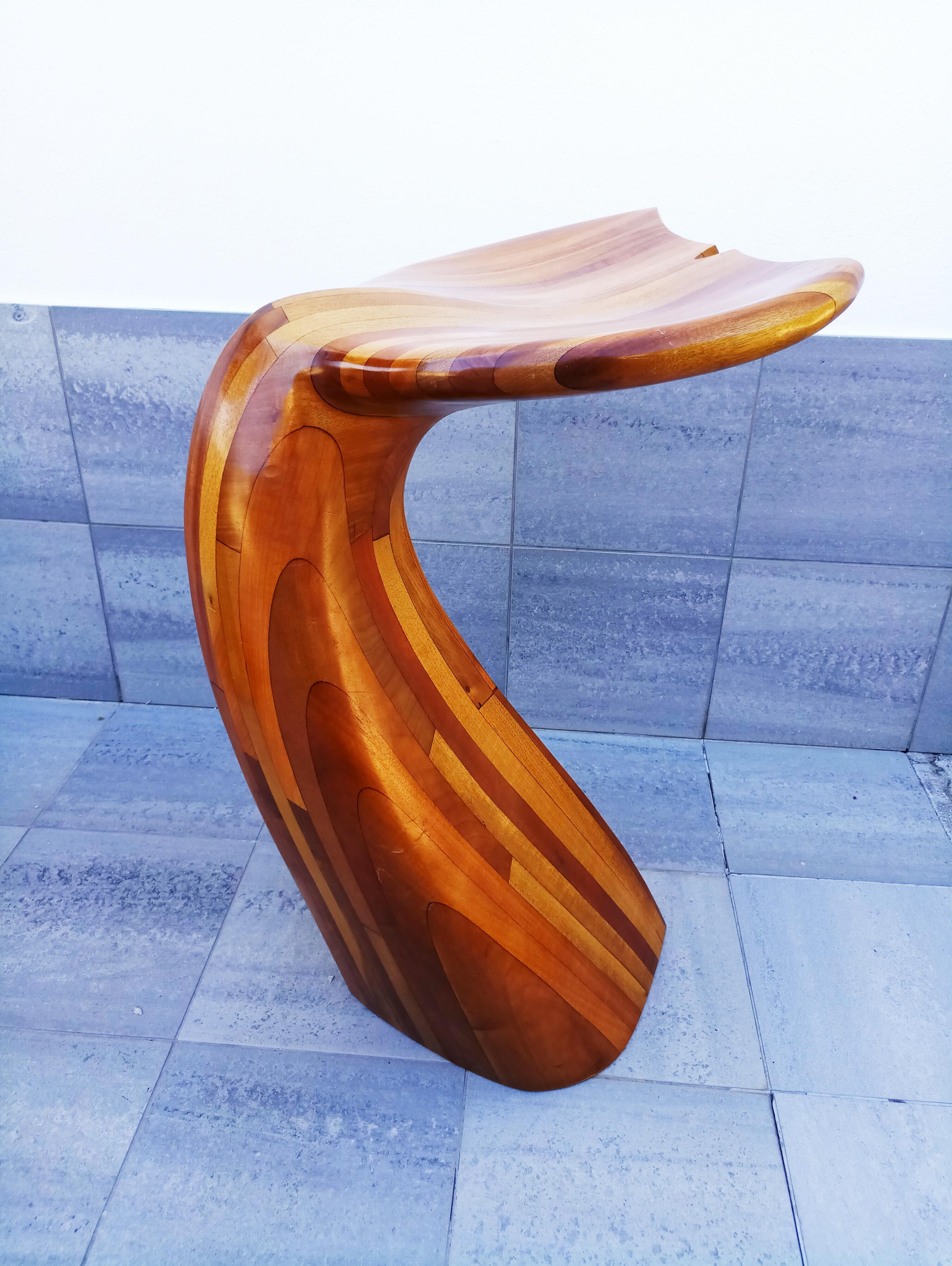 Rare wooden whale tail bar and stools set, manufactured in France in 1980s.
They are made of impressive quality tropical hardwood in a multi-toned warm brown color, crafted with a fine eye for detail and smooth, curvey shapes resembling the tail of