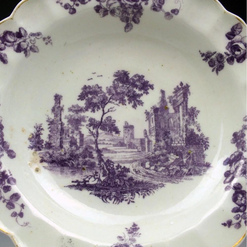 Heading : Worcester porcelain dessert plate
Date : circa 1765
Period : George III
Marks : None
Origin : Worcester, England
Colour : Transfer printed in puce with gilded rim.
Size : 20cm in diameter
Condition : Good, wear to the gilded rim.