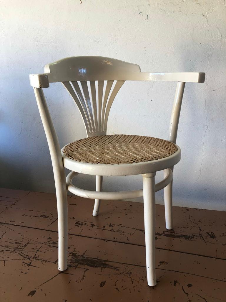 This rare Thonet chair is a so called writers chair / desk chair. Because of the position of the legs you can sit on the edge of your chair without tipping over. The chair is sturdy and the seating is in good condition (new webbing). Original label