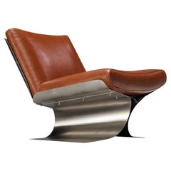 Rare chaise longue Xavier Féal en acier brossé et cuir cognac 