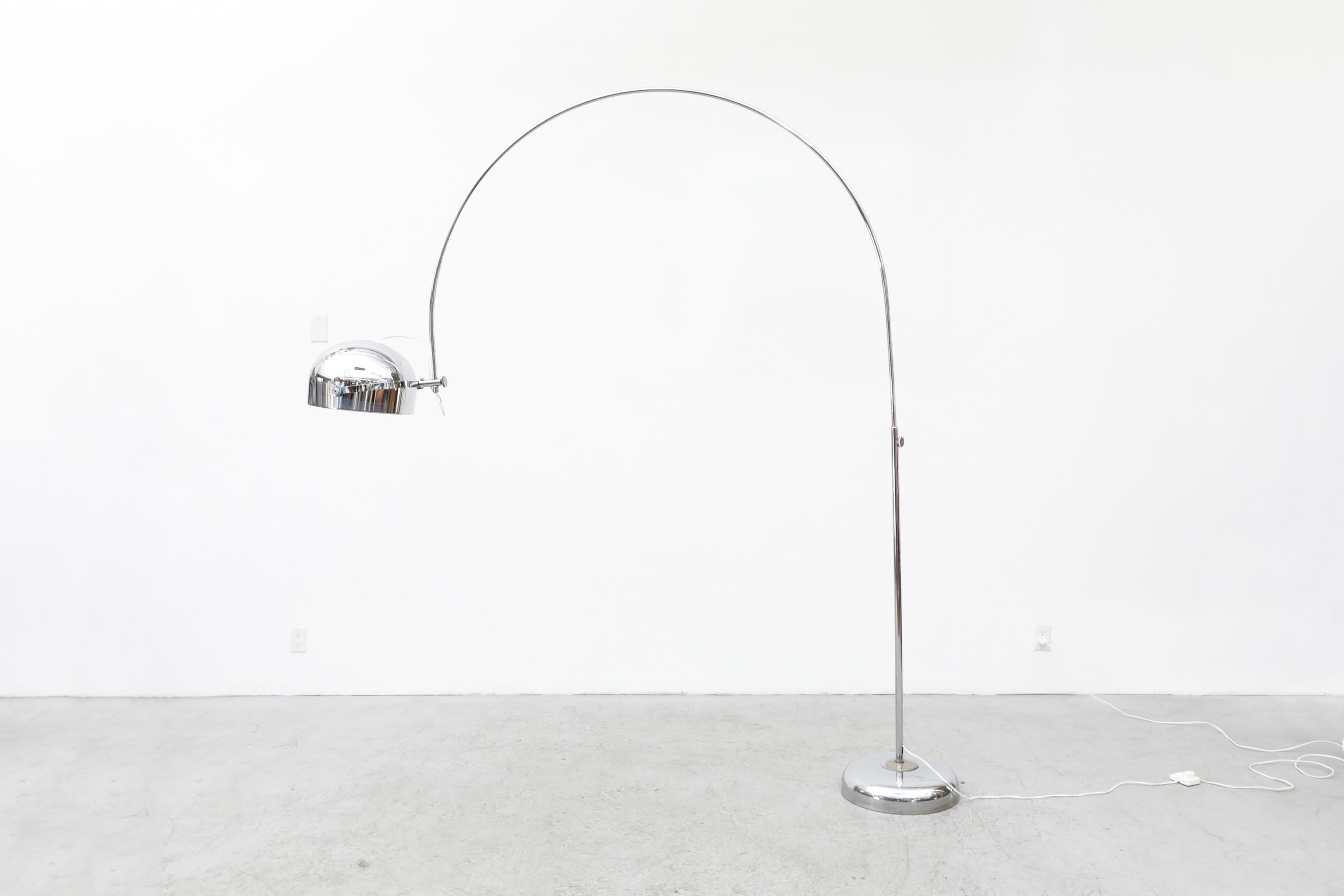 Mid-century chrome plated arc lamp with a weighted base by Gepo. The shade can be rotated and positioned in varying ways. In original condition with some minor chrome pitting and a slight dent to the shade. Wear is consistent with its age and use.