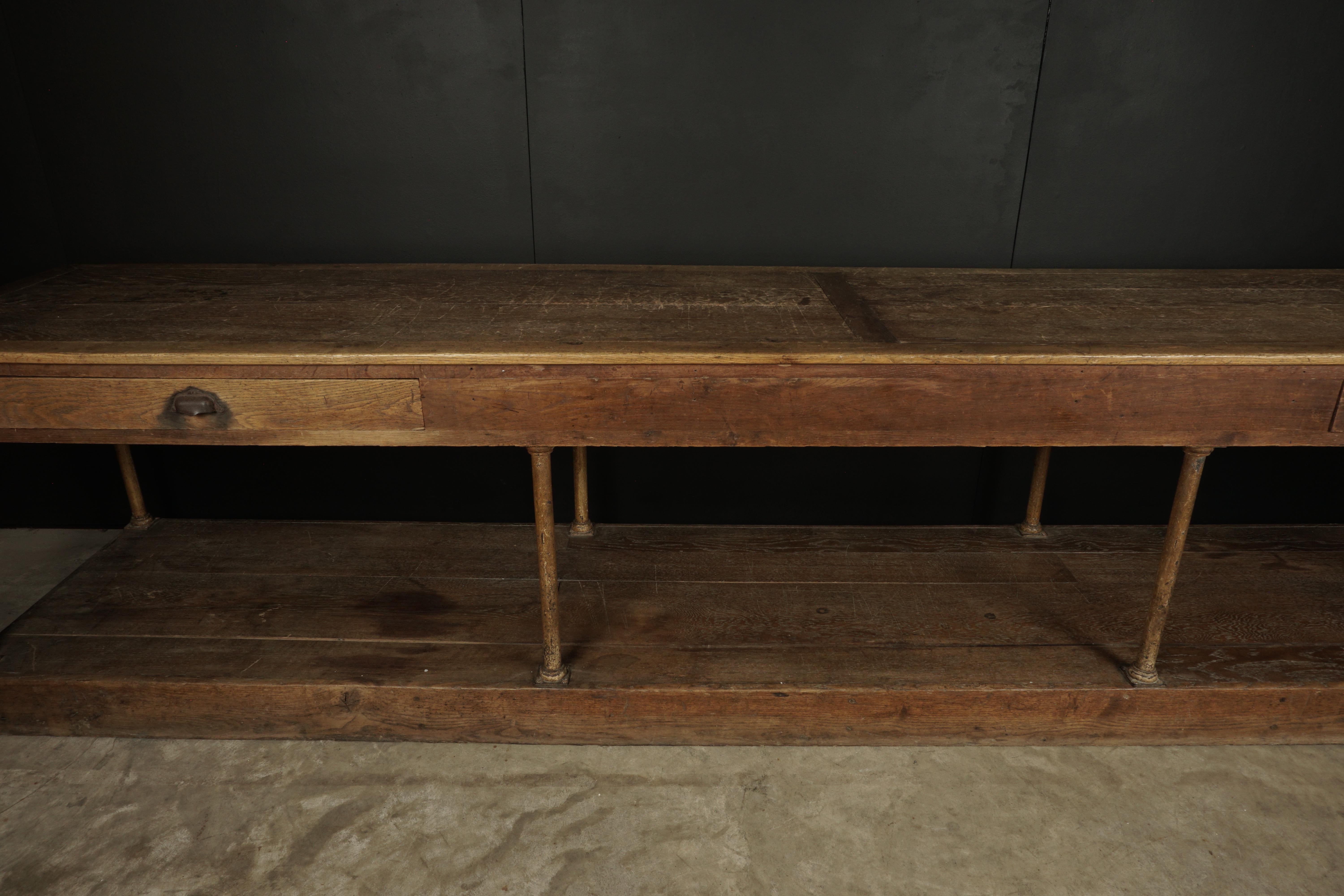 Rare extra large oak console from France, circa 1900. Solid oak construction with iron supports. Amazing patina. Was told it was from a large manor house in the south of France.