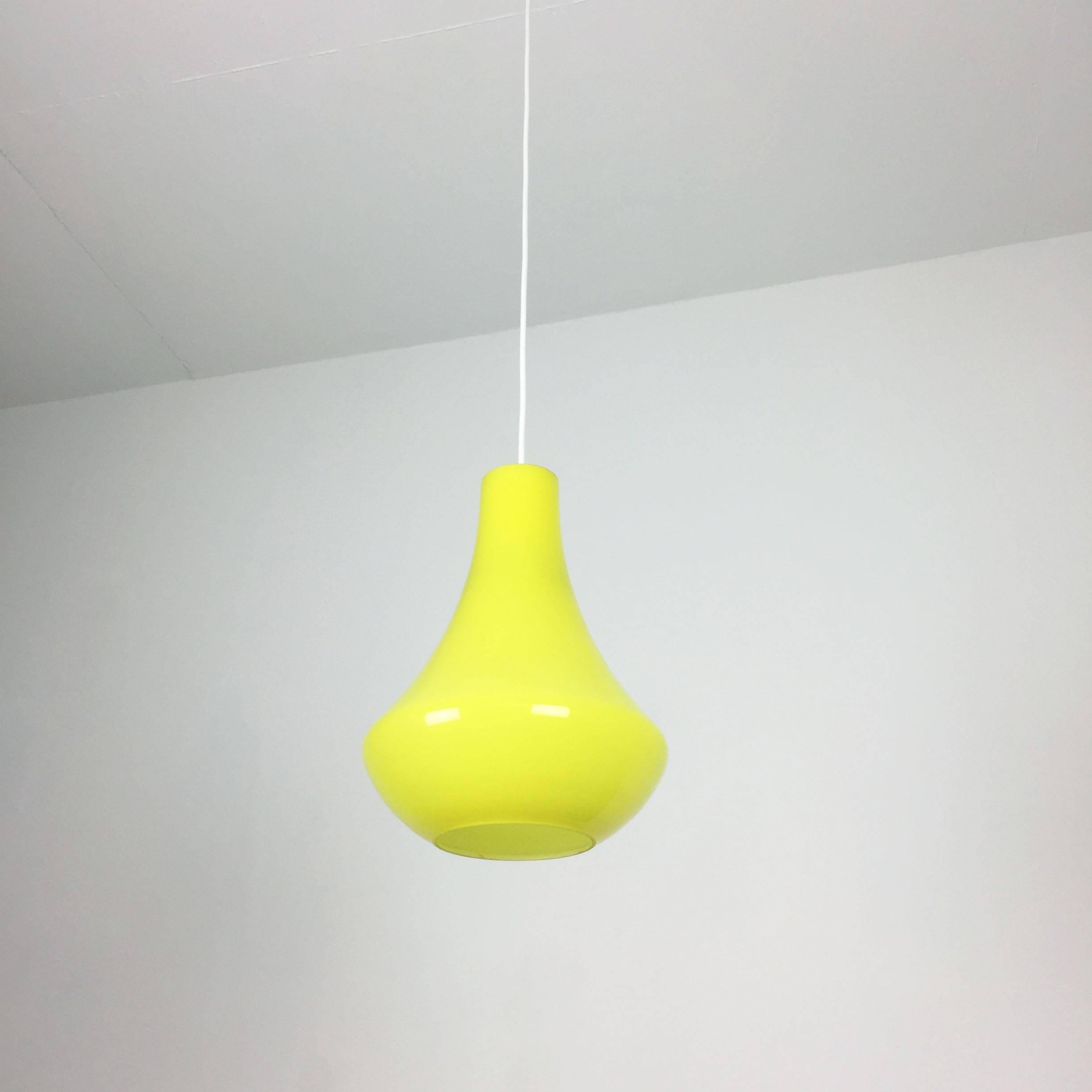 Article: hanging light


Producer: Peill & Putzler


Origin: Germany


Age: 1970s 


Description: 

This fantastic yellow drop hanging lights was designed and produced in 1970s in Germany by Peill & Putzler. the shade is made of high