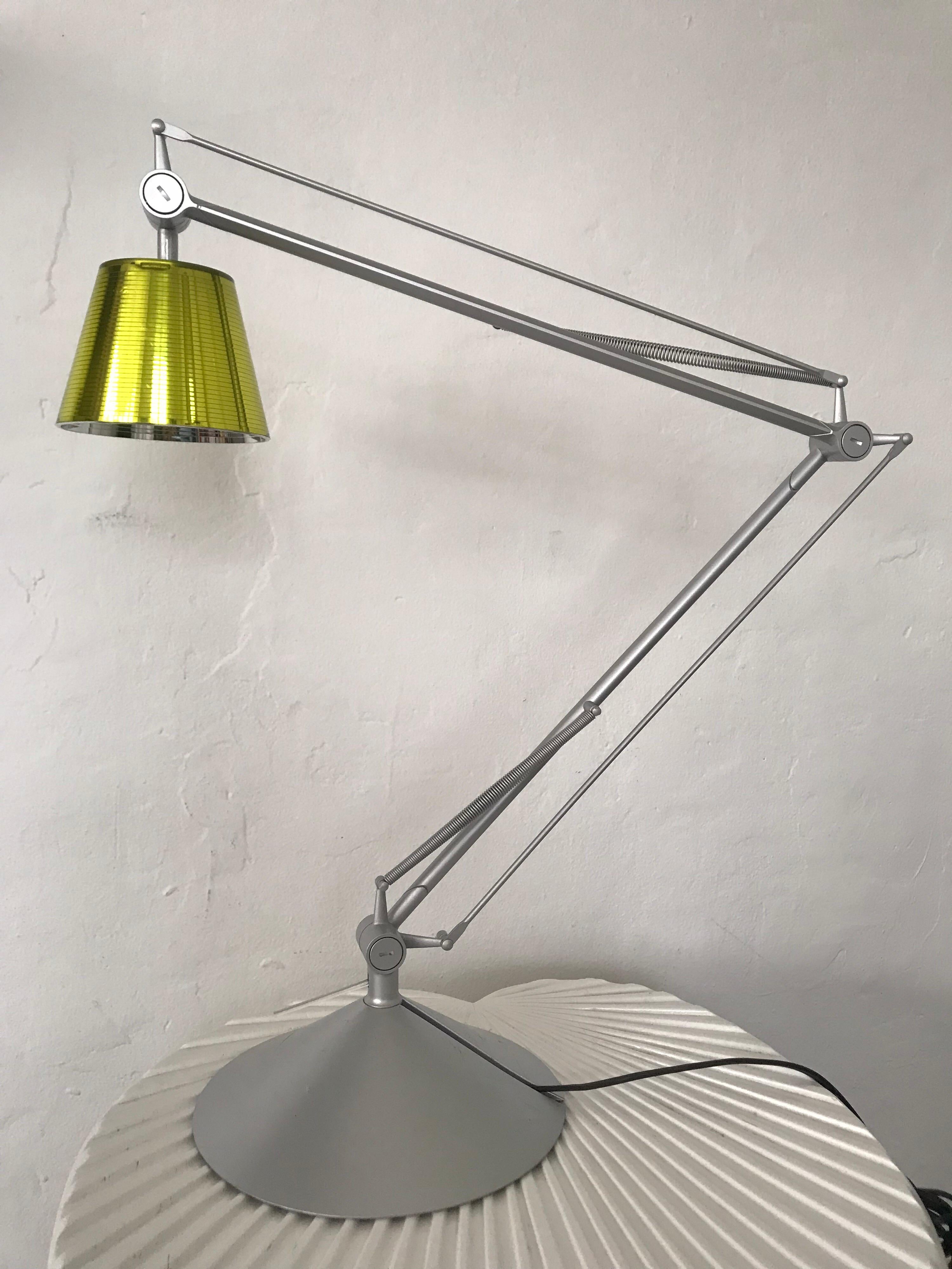 No longer produced yellow Archimoon K adjustable desk, task, or table lamp rendered in silver anodized aluminum, designed by Philippe Starck for Flos.

Lamp is currently wired with 2 prong Euro plug, can be converted to US standard if desired.