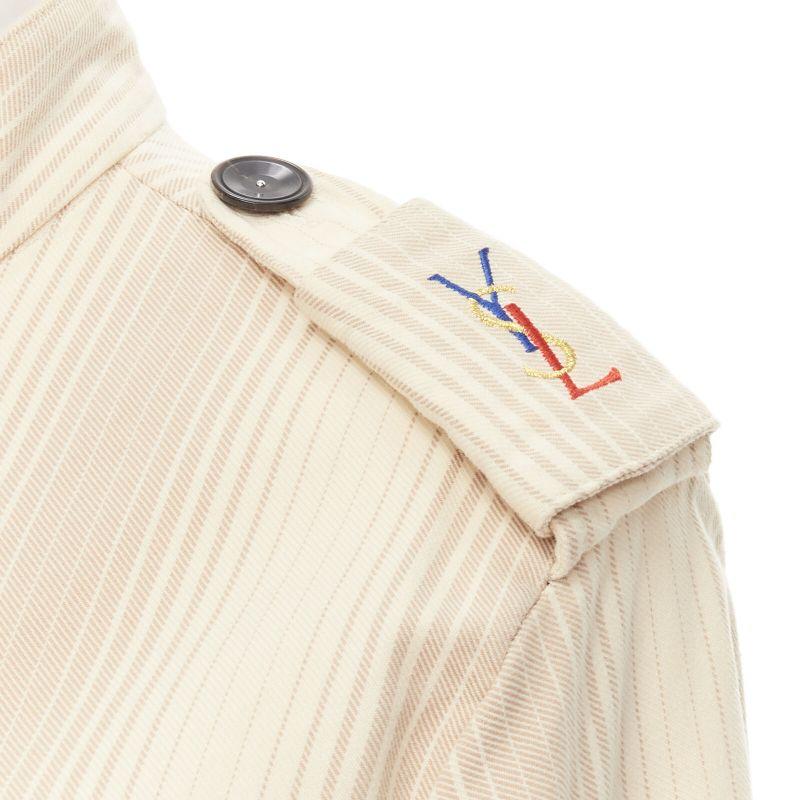 rare YVES SAINT LAURENT Vintage beige YSL badge military captain shirt
Reference: CRTI/A00726
Brand: Yves Saint Laurent
Material: Feels like cotton
Color: Beige
Pattern: Striped
Closure: Button
Extra Details: Colorful YSL logo on