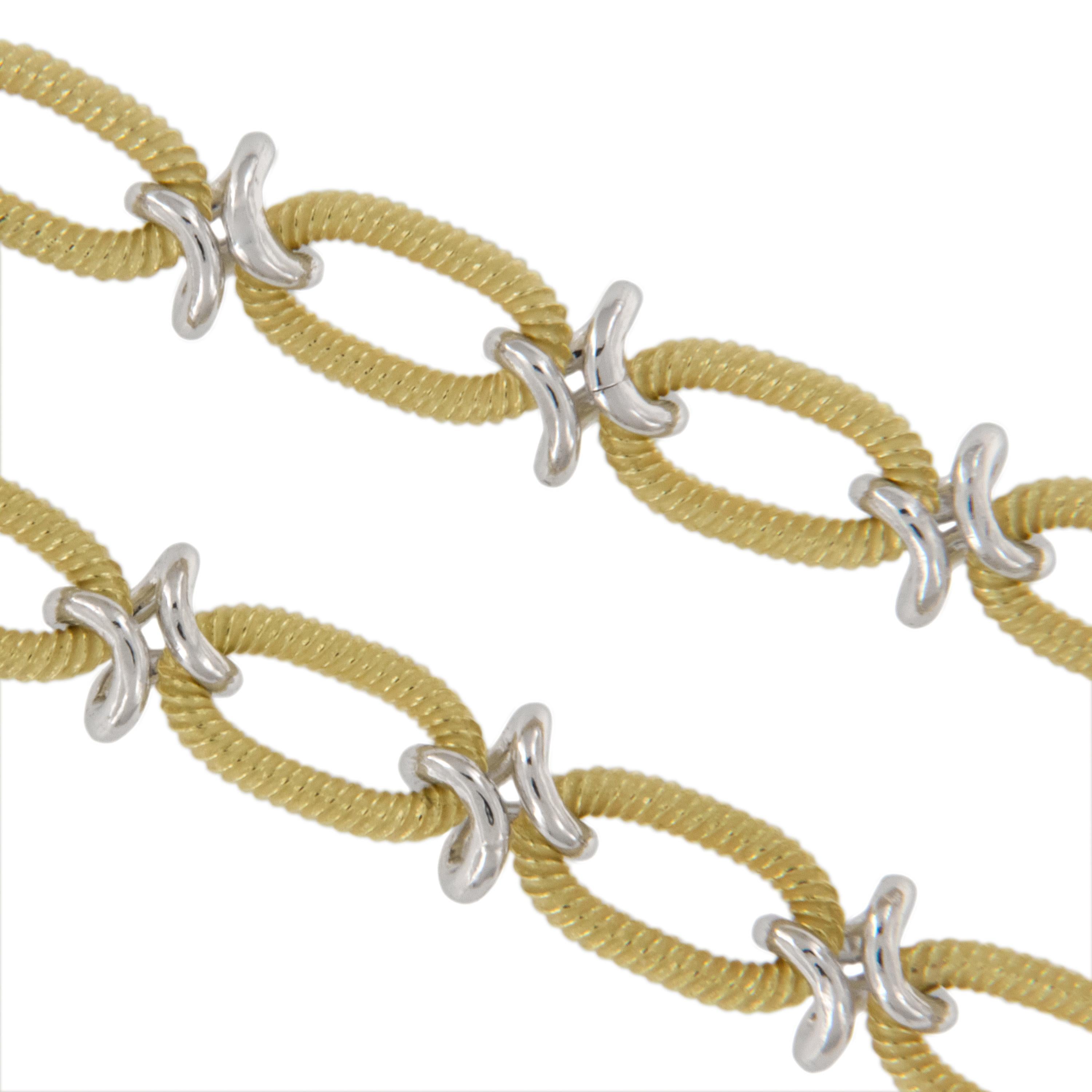 Well known for their fine craftsmanship, the Italians hand make the loveliest chains and this one is no exception! Fine 18 karat yellow textured oval links intermingle with bright polished white gold infinity connector links for an 18