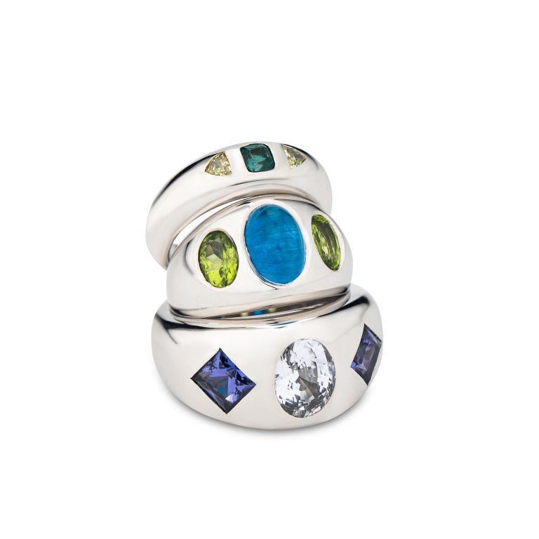 This distinct and very elegant, finely crafted ring can be worn by either males or females. A natural octagonal granddidierite of this pure and clear color is very rare. To enhance its exclusivity we have it accompanied by a fancy yellow trilliant