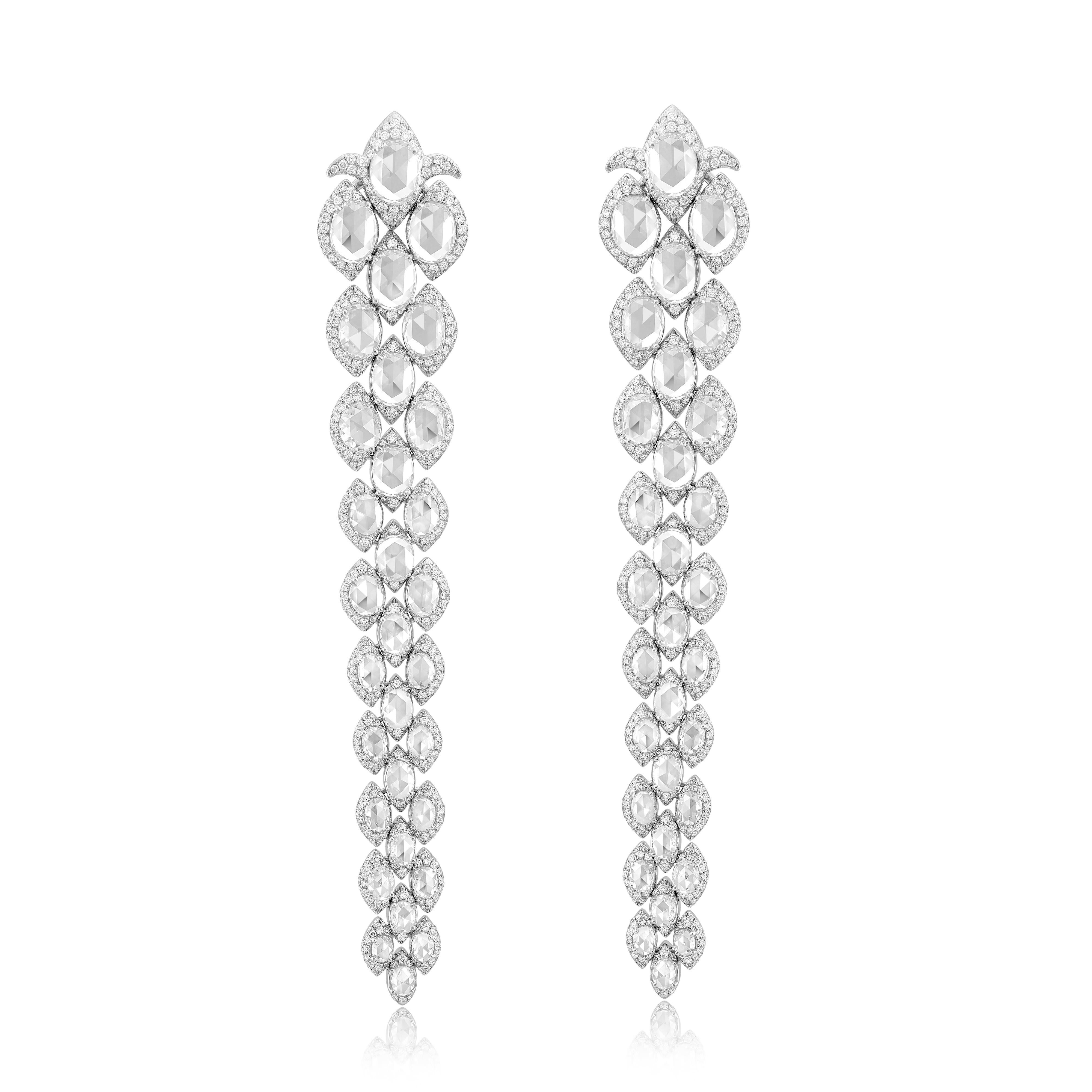 These statement earrings are crafted with special Rose Cut diamonds (10 - 70 Points each in size) surrounding a round brilliant cut diamonds. Handcrafted from lightly hammered 18-karat gold and traced with 17.2cts of glittering top quality white