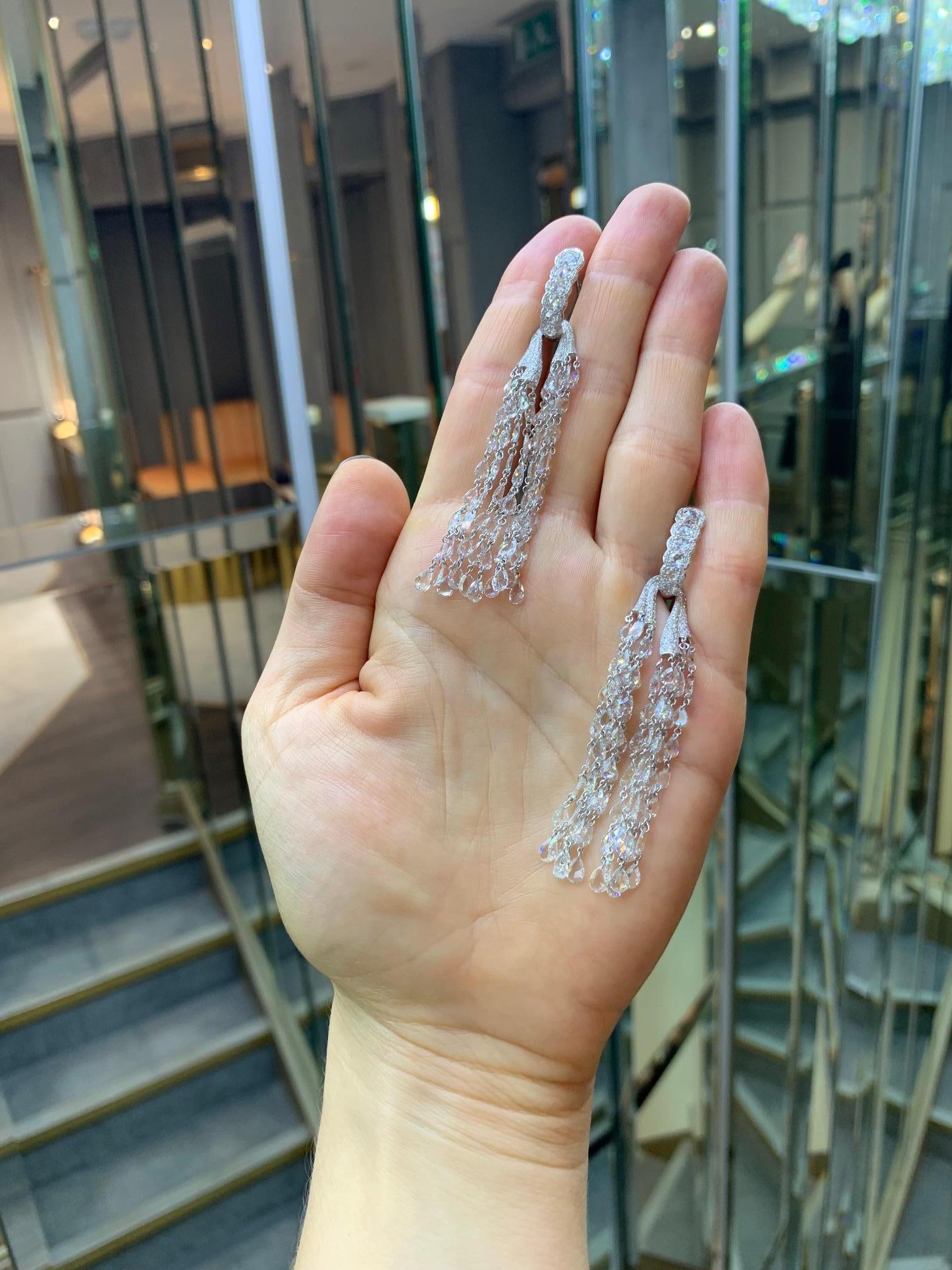 Referencing old school glamour, these opulent earrings drape the neck gracefully, catching the light with every movement. Crafted with a heady combination of 154 rose cut pear and 12 round brilliant diamonds they are finished with 338 micro pave set