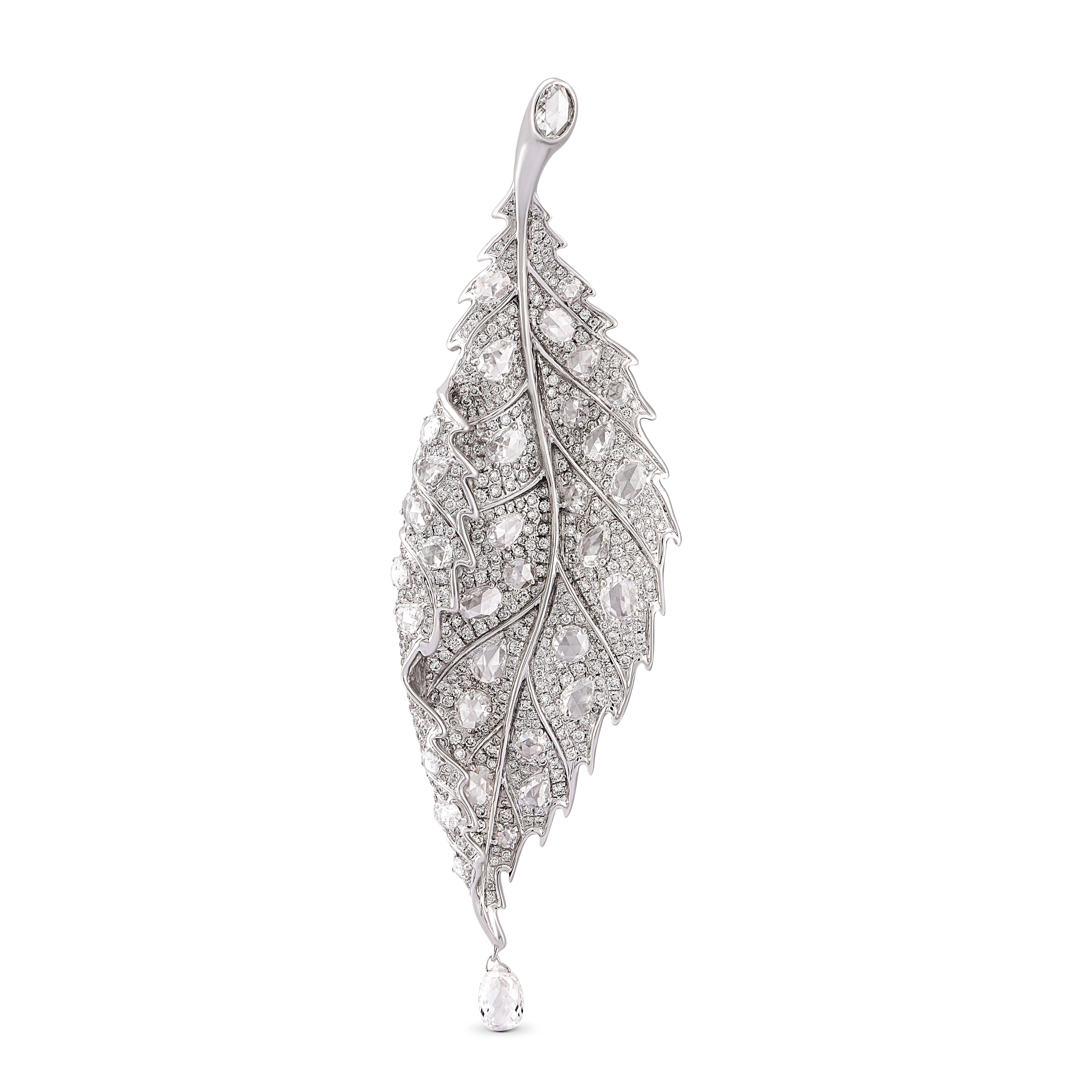 This stylised brooch is intricately crafted with 33 rose-cut and 569 pave set round brilliant diamonds. A single 0.57ct briolette cut diamond represents a drop of morning dew, giving an air of realism to this otherwise whimsical jewel. 

Total