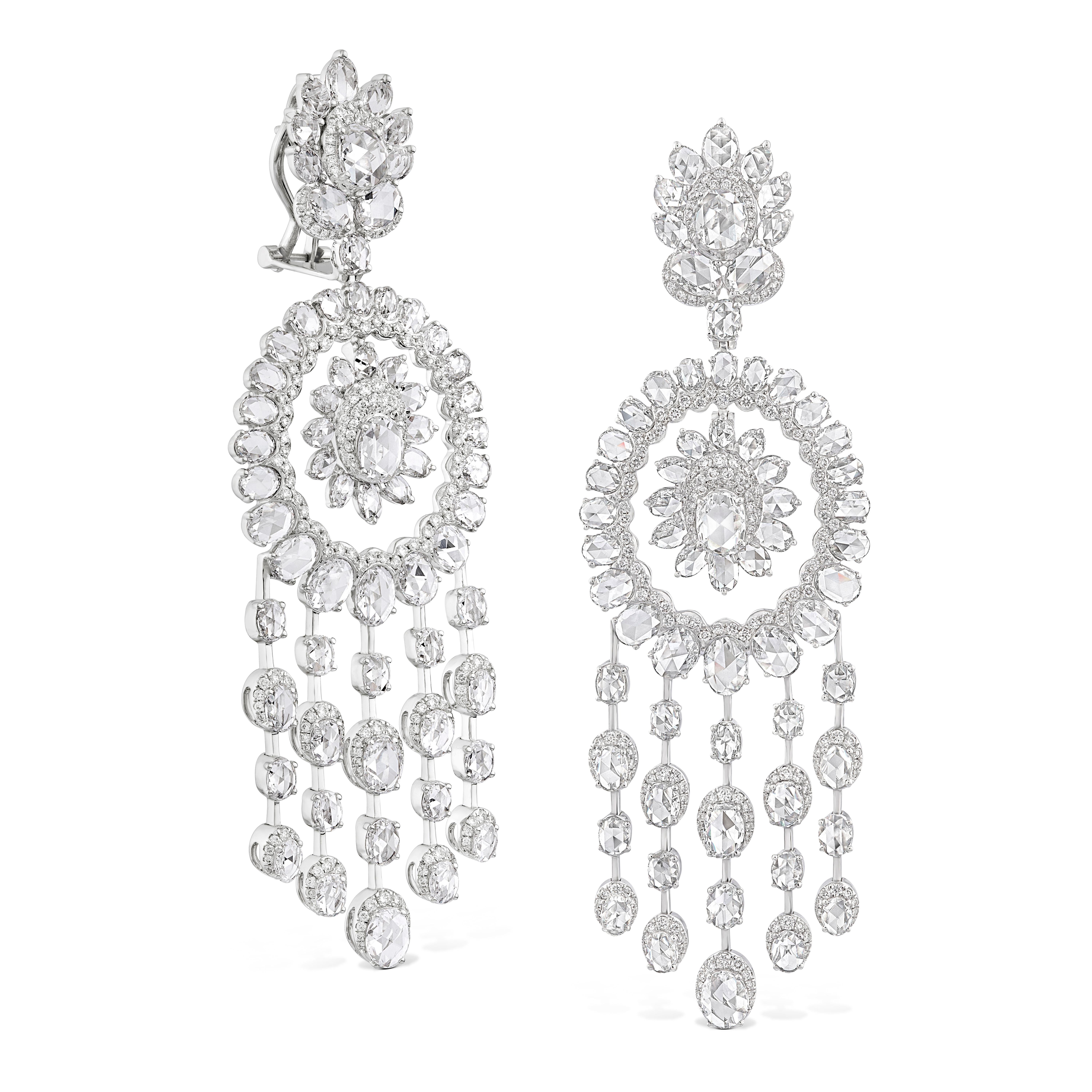 These mesmerising chandelier earrings draw reference from the world of dreams, with their silhouette inspired by that of a dream catcher. Studded with 133 oval rose-cut and 478 round brilliant diamonds, these ethereal jewels glimmer with every