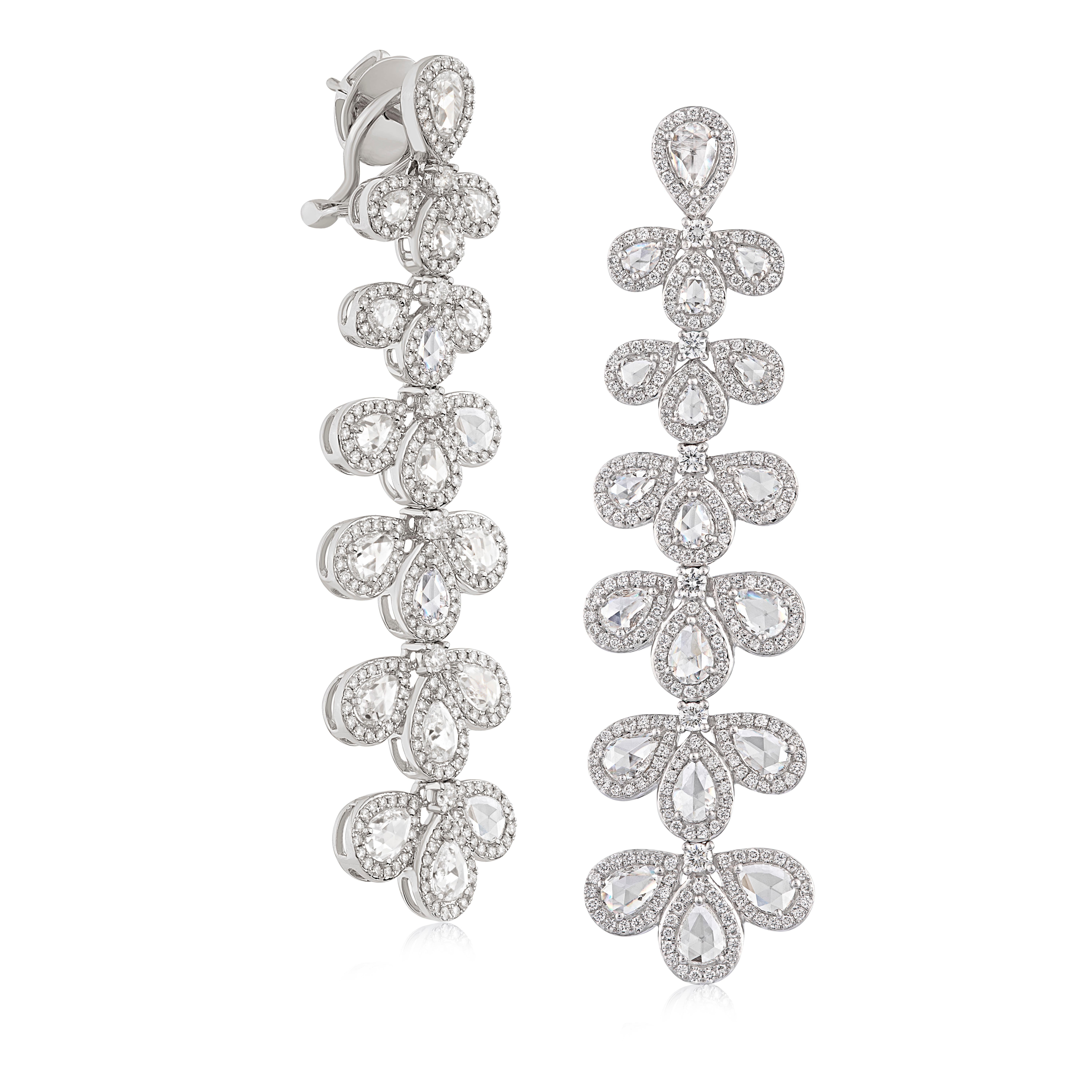 These ornate hanging earrings are crafted with 38 rose-cut and 584 round brilliant cut diamonds, meticulously matched for optimum sparkle. 

Total diamond weight 5.32cts.
Diamonds are F/G colour VS clarity.
Gold weight: 21.14g.

Rarever specialises