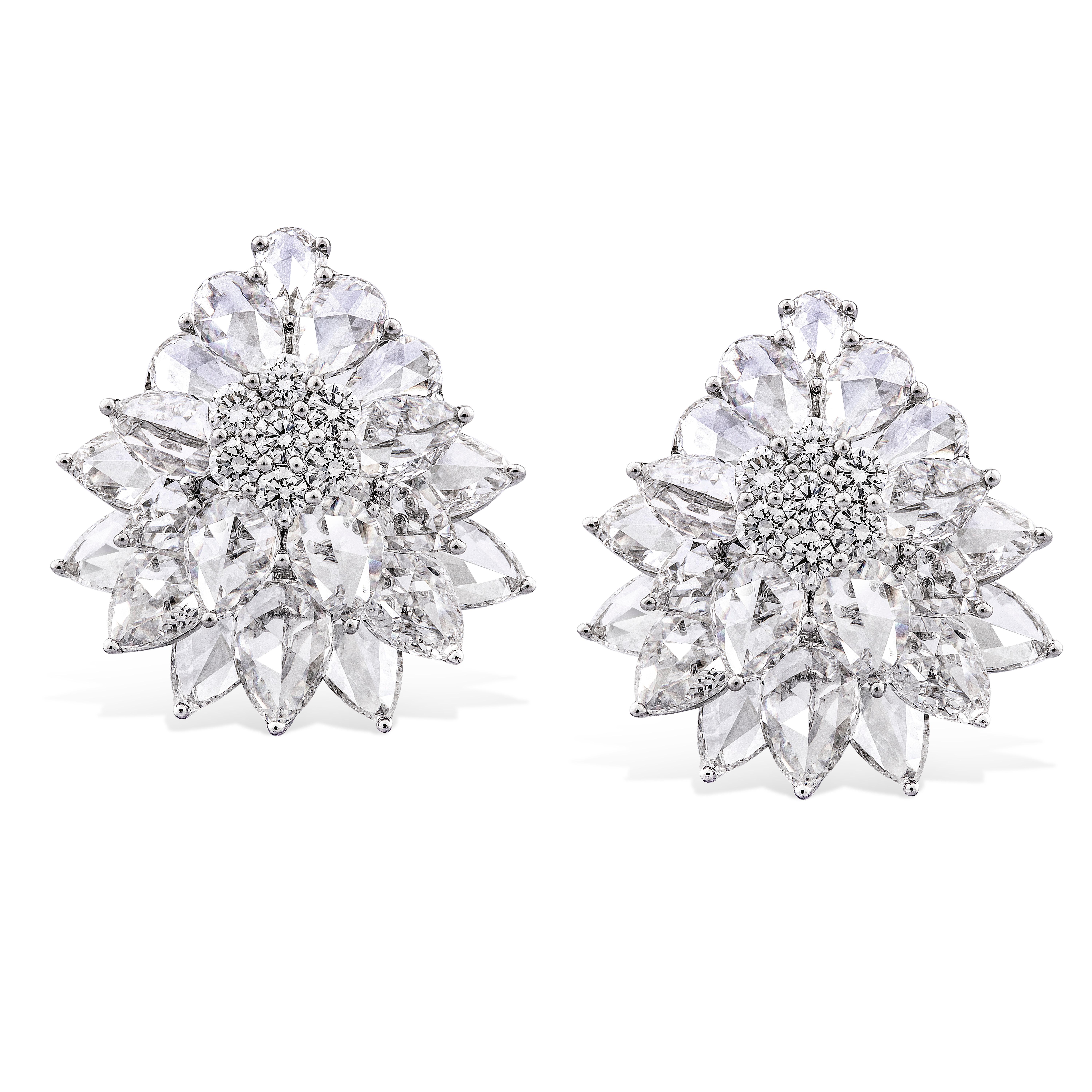 Inspired by the blooms of nature, these floral ear studs are crafted using 40 pear shape rose-cut diamonds to recreate their delicate petals. The centres of the flowers are formed of 14 round brilliant cut diamonds to ensure maximum sparkle. 

Total