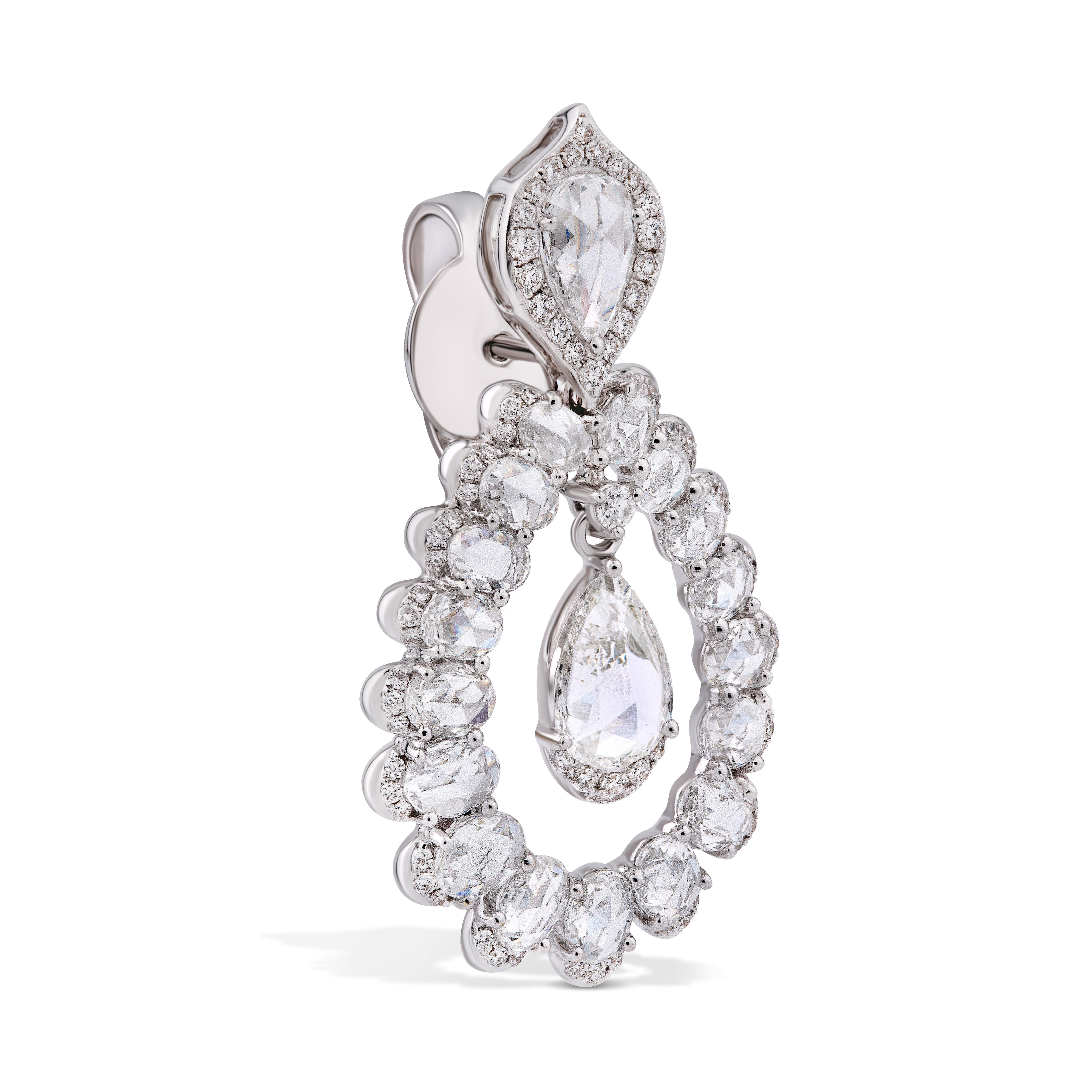 Inspired by the arches of Persian palaces, these elegant earrings are comprised of 34 oval rose-cut diamonds curving around two suspended pear-shaped rose-cut diamonds of 0.39cts each. 152 micro pave set round brilliant cut diamonds, add to their