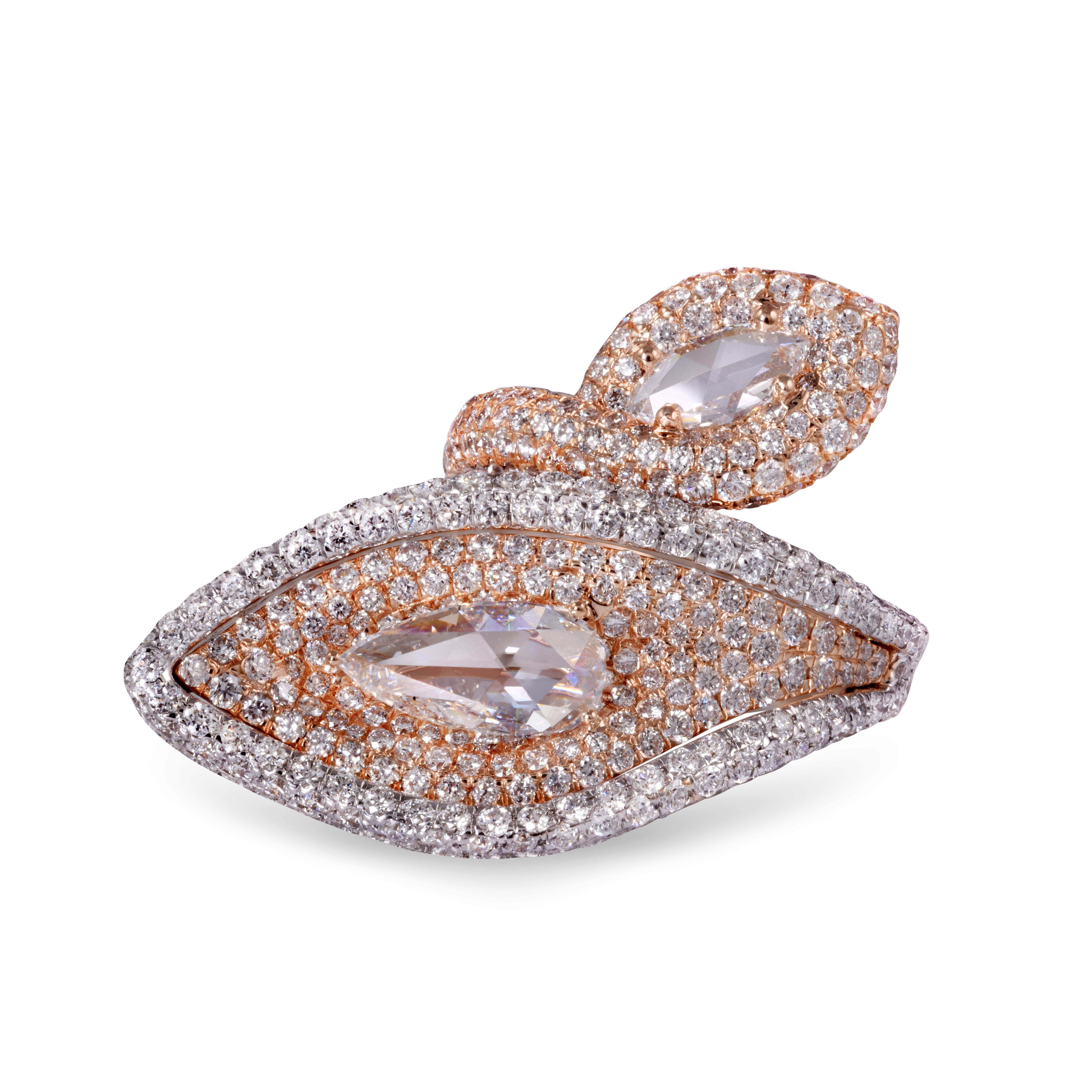 This ring takes its inspiration from morning dew on a leaf. This exclusive Rarever piece is designed with a rose-cut pear shape diamond of 0.71cts and a 0.30cts Marquise diamond surrounded by micro pave diamonds with alternating white and rose gold