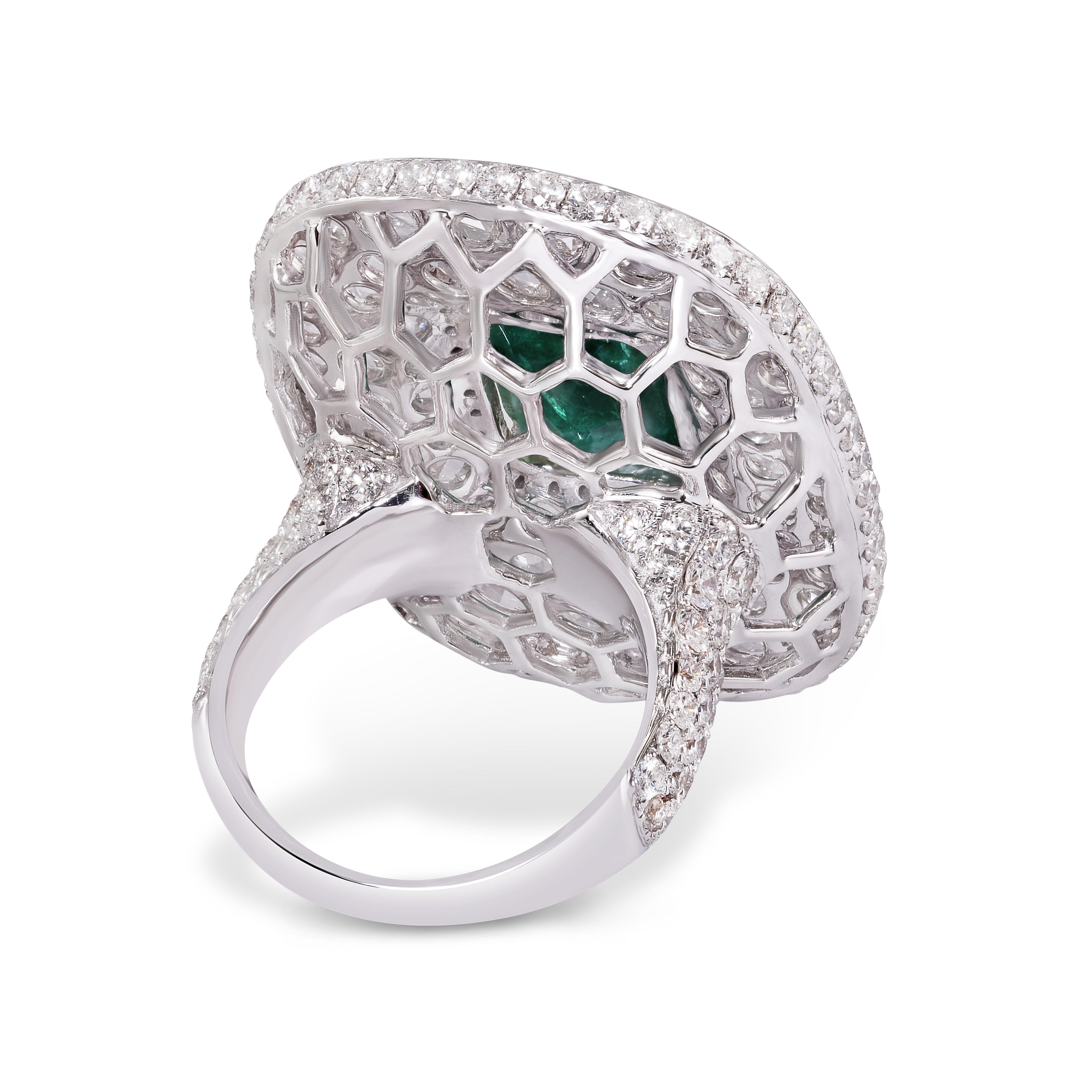 This iconic Rarever ring highlights an untreated, 6.13-carat Zambian emerald, set within a mosaic of rose-cut diamonds. Honouring the traditions of ancient artisans, this ring is handmade from 18-karat white gold and is carefully inlaid with