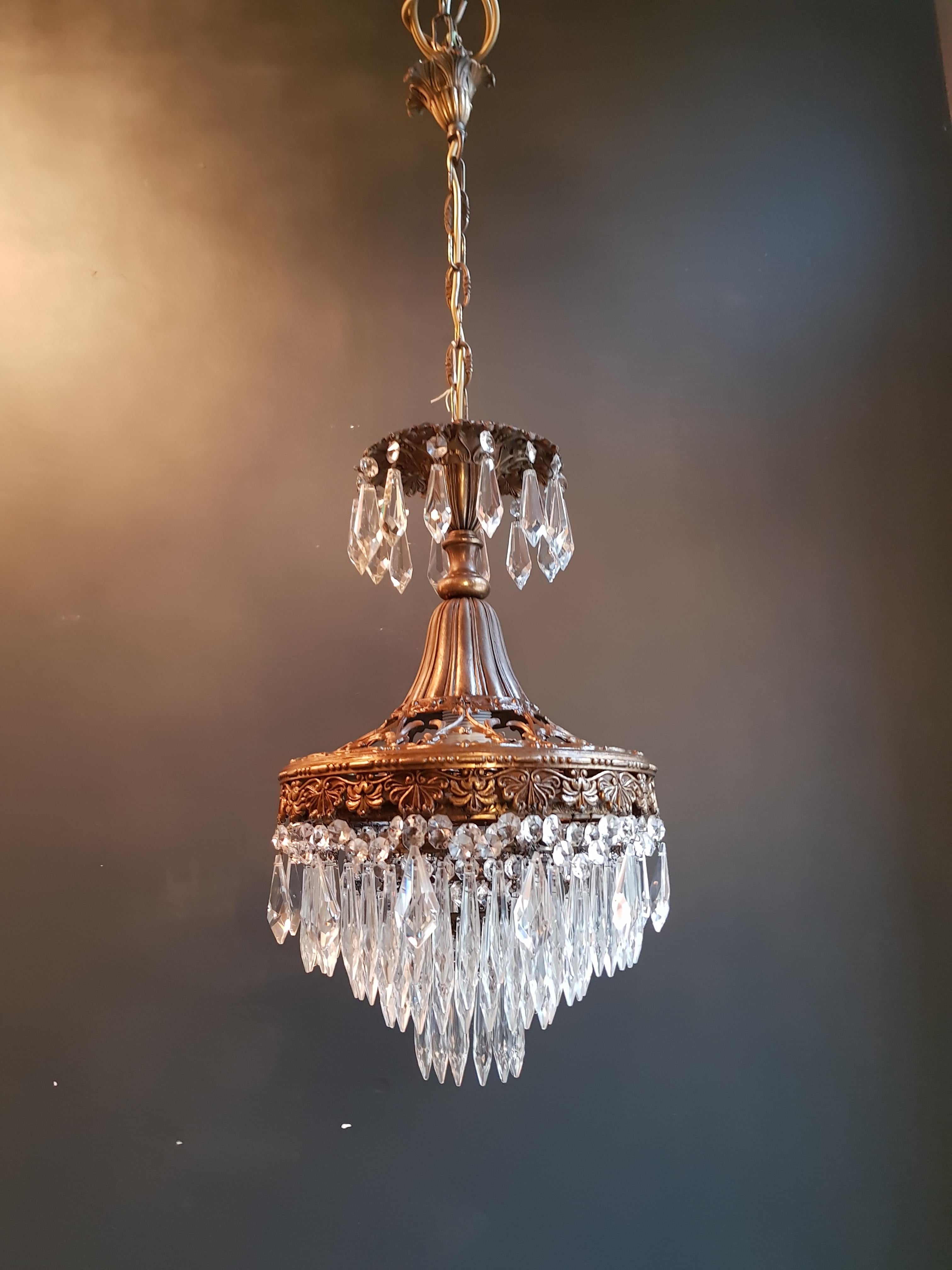 This fine pretty showpiece. Original preserved chandelier, circa 1930. Cabling and sockets completely renewed. Crystal hand knotted
Measures: Total height 99 cm, height without chain 53 cm, diameter 30 cm, weight (approximately) 5 kg.

Number of
