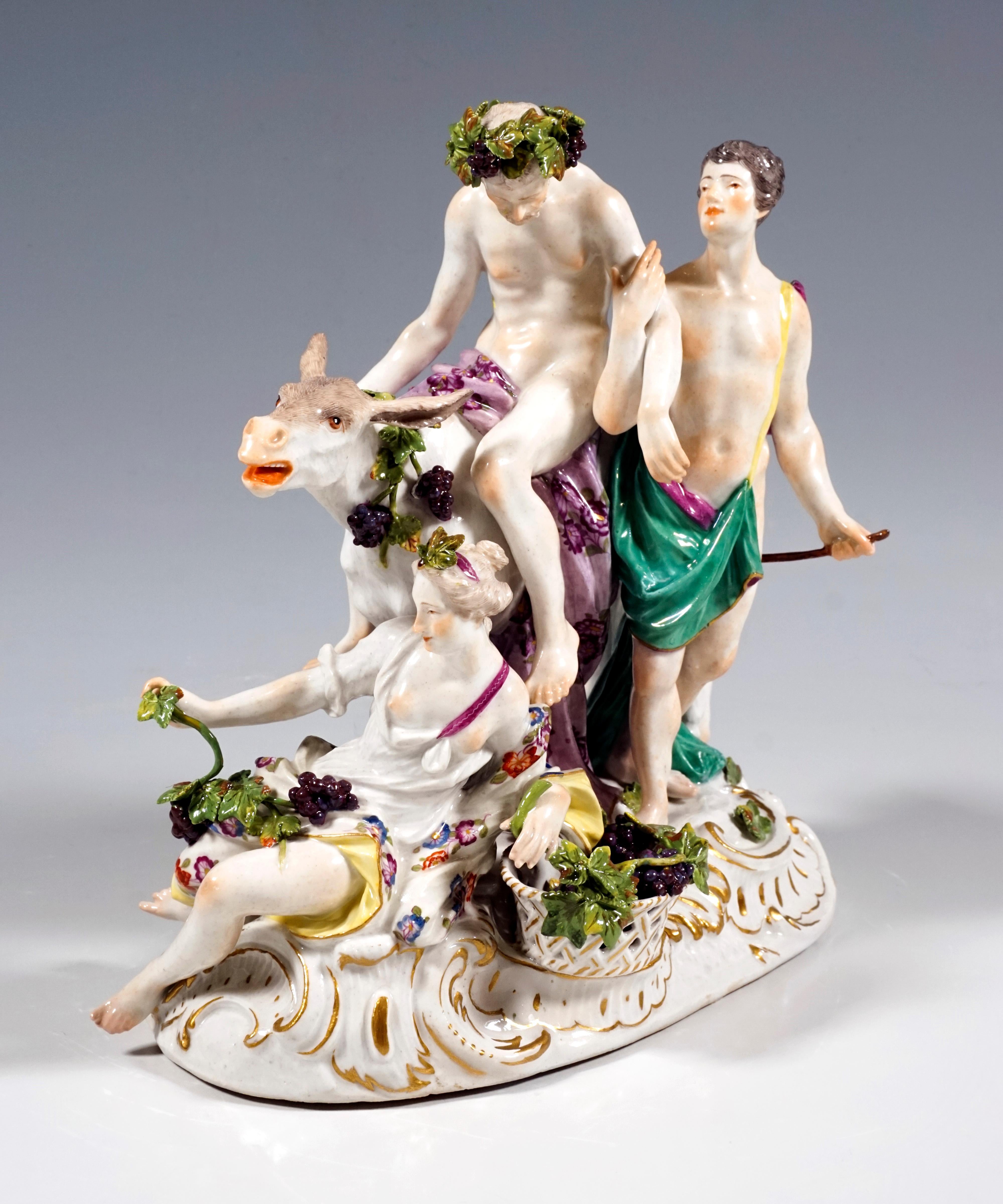Original Rococo Meissen Group from the 18th century.
The visibly drunk Silenus, crowned with a wreath of grapevines, sits on a donkey and is supported by a young bacchante so that he cannot fall off. A loosely clad nymph lies on the ground in front