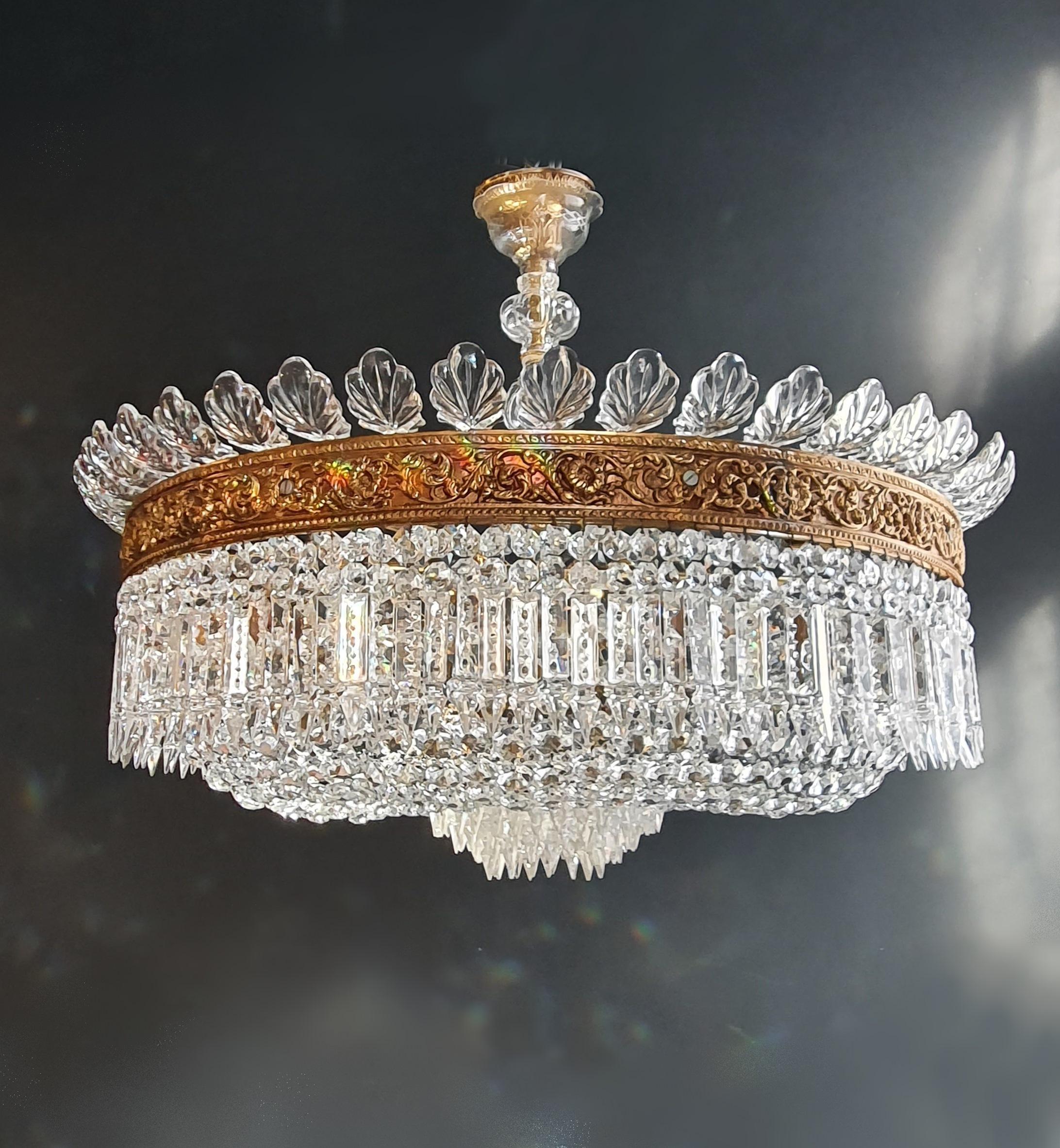 Presenting a pair of exquisite basket chandeliers, designed to complement each other perfectly. Both chandeliers have been thoughtfully restored and revitalized to their original grandeur. The restoration process involved a complete overhaul,