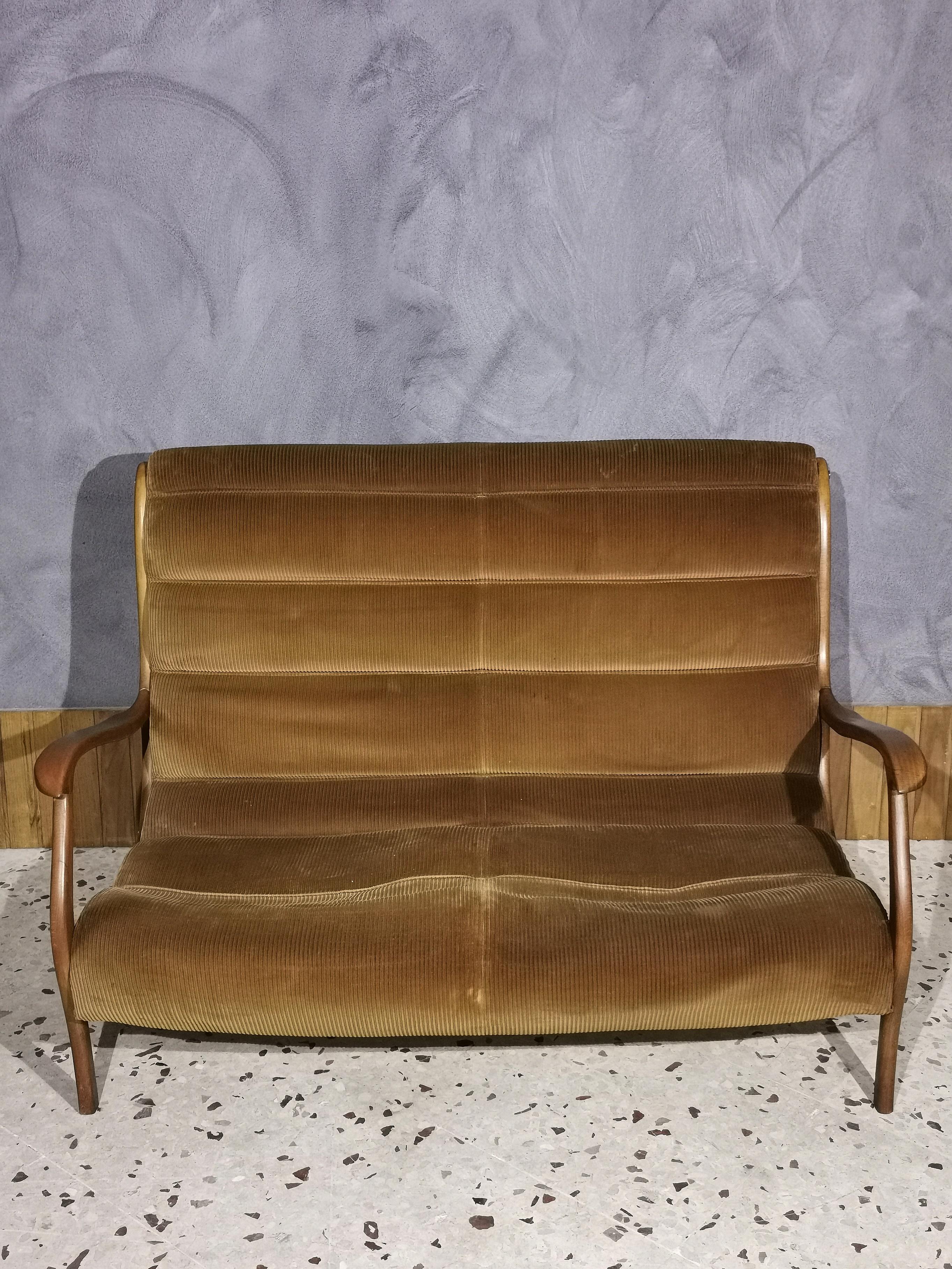 Beautiful and rare 2-seat sofa by designer Ezio Longhi for Elam from 1958, with covering
original in cognac-colored striped velvet, wooden structure and brass finishes, Italy.