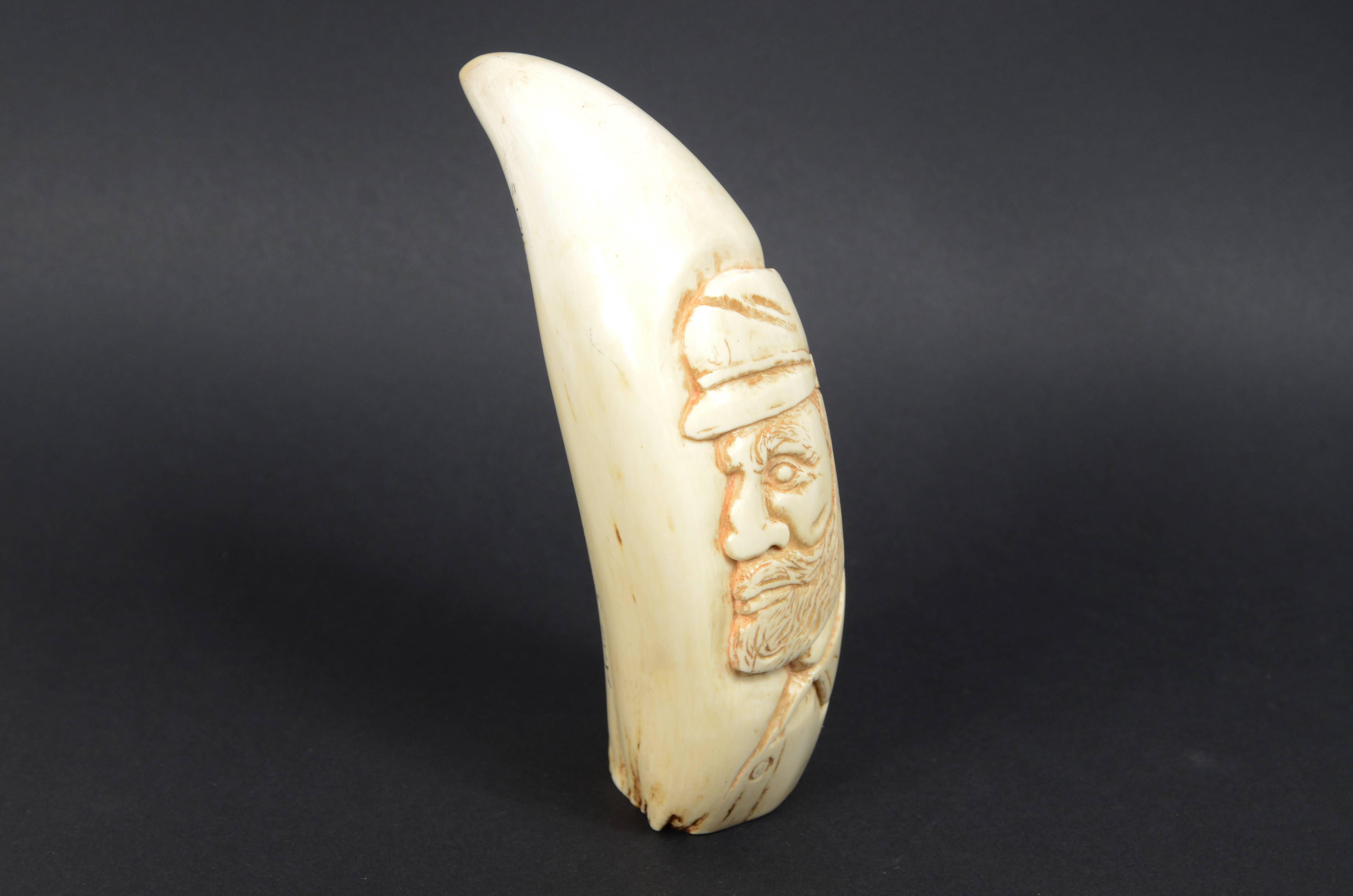 Rare scrimshaw of large whale tooth in vertical bas-relief a sailor For Sale 2