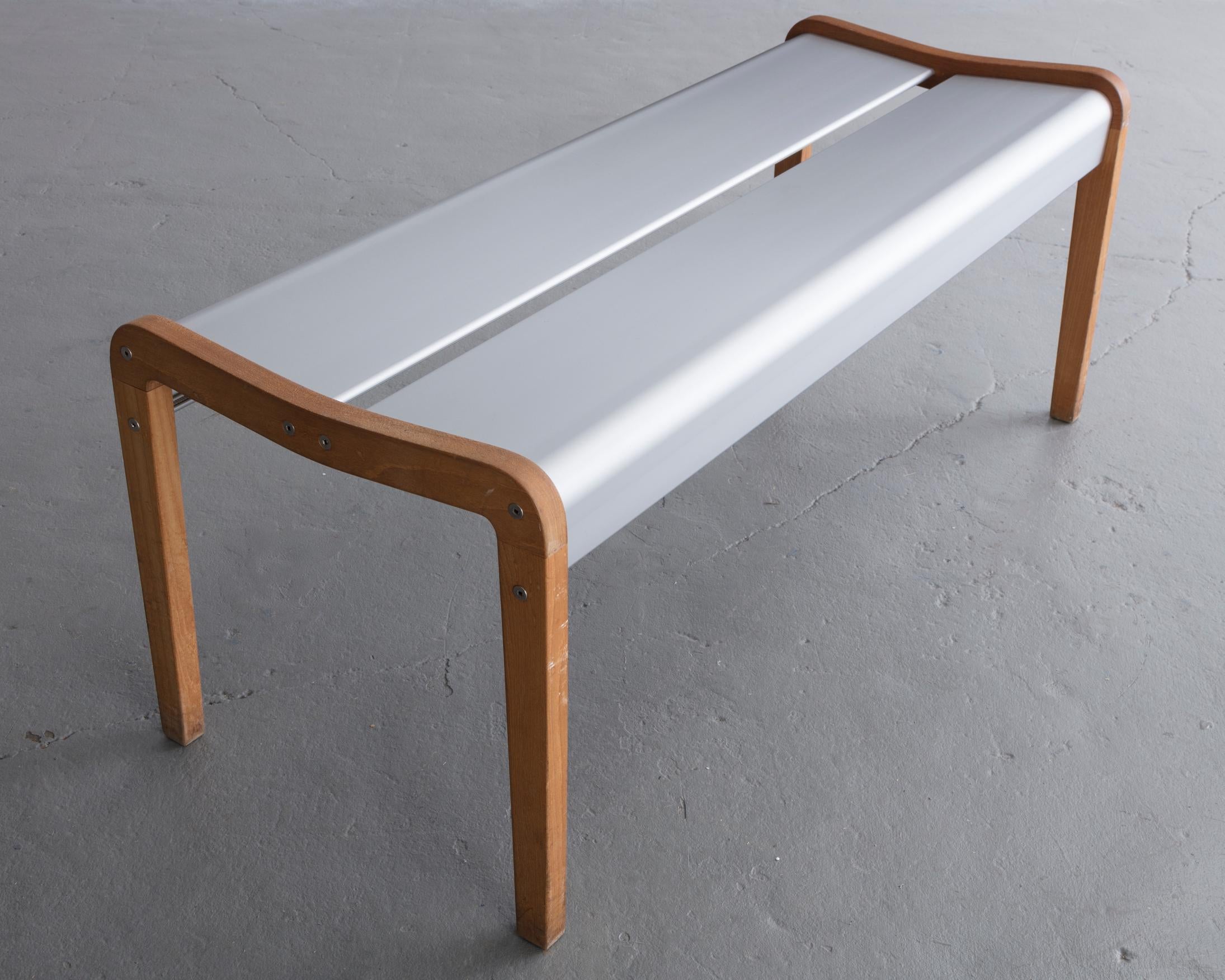 Rasamny bench v. 2 in anodized extruded aluminum and wood. Designed by Ali Tayar, 1999. Produced by ICF New York.