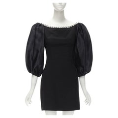 RASARIO - Robe noire à col bénitier ornée de cristaux et manches ballons FR36 S
