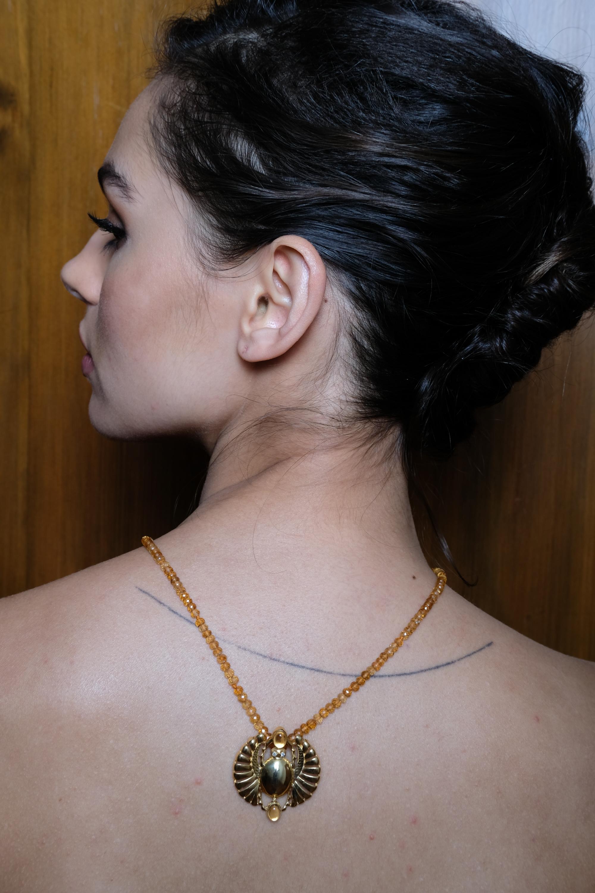 red beads necklace with gold pendant