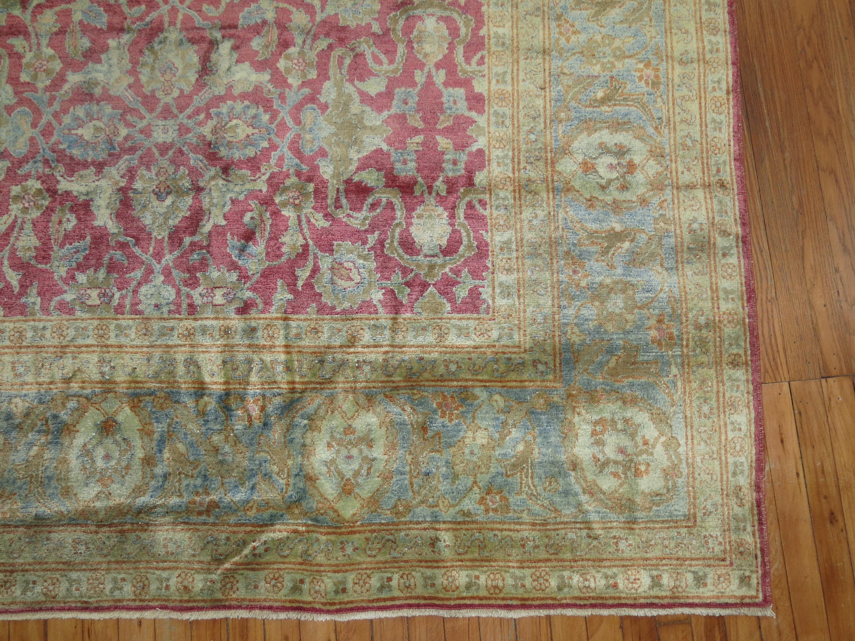 An all-over design Traditional Persian Tabriz rug with a blush raspberry pink ground and gray icy blue. The rug has a very soft silk sheen to it and soft on the feet.

Measures: 10' x 17'.