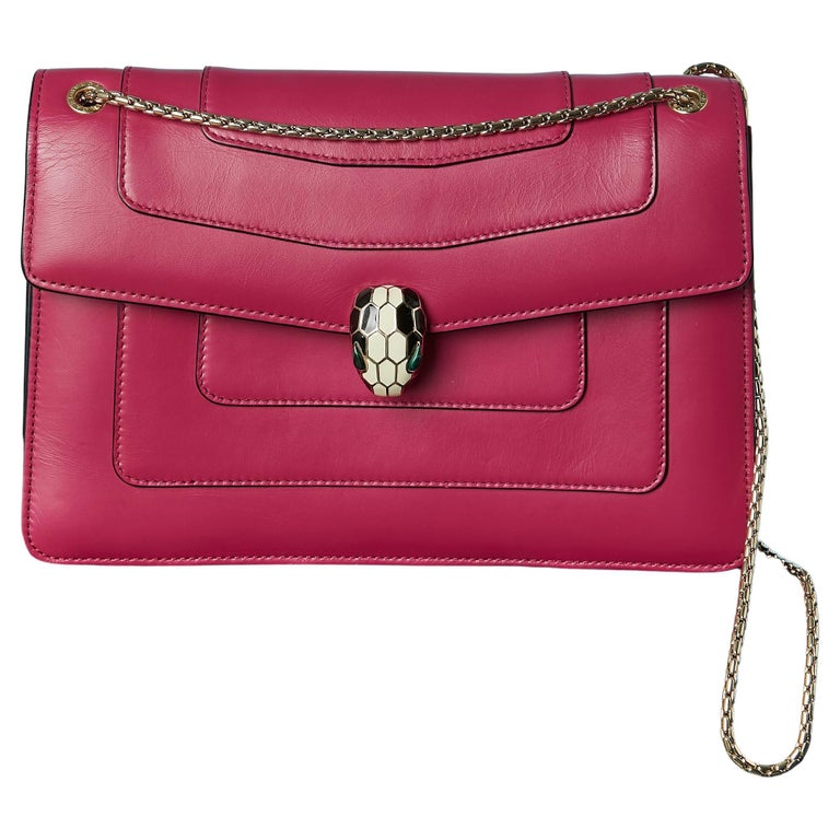 Sac à bandoulière rose framboise avec fermeture en forme de tête