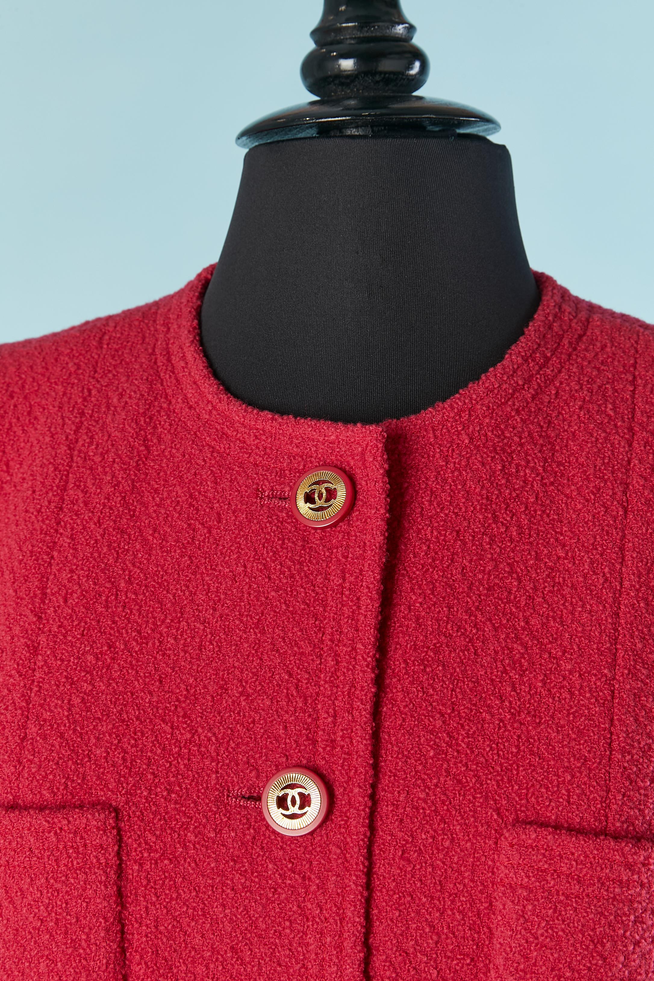 Raspberry pink tweed single breasted jacket. Silk branded jacket. 
Shoulder pad. Branded button and buttonhole closure on the middle front and on the cuffs. Chain inside the jacket on the bottom edge. 
SIZE 42 (Fr) L 