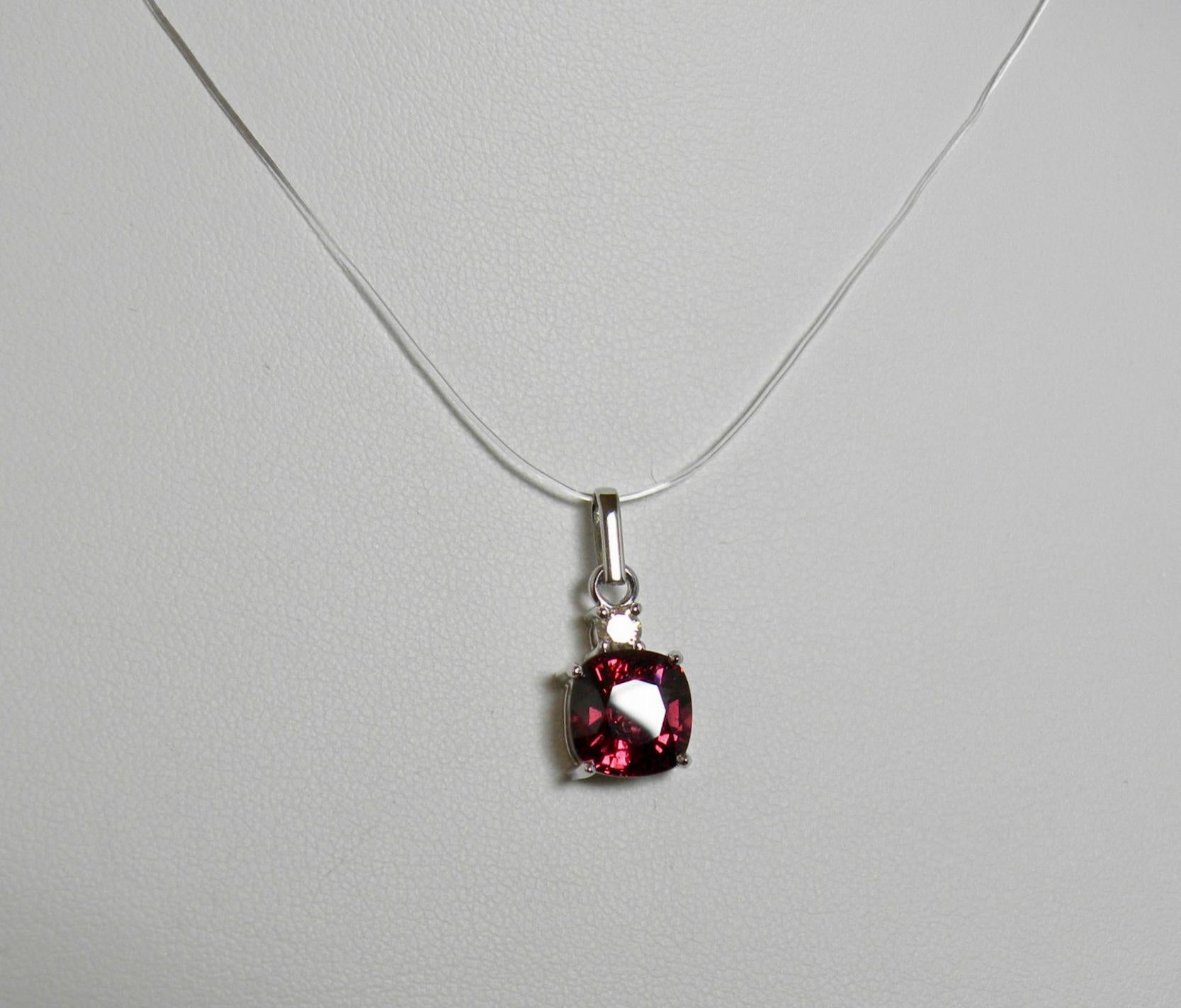 Sparkling Natural Spinel cushion-cut, raspberry(purplish-red) color /clarity VS, weight 3.84 carat accented with a round cut diamond 0.15ct. The pendant is great for every day wear!
Pendant Measurement: 21.00mm x 9.14mm, rising 6.34mm
Composition: