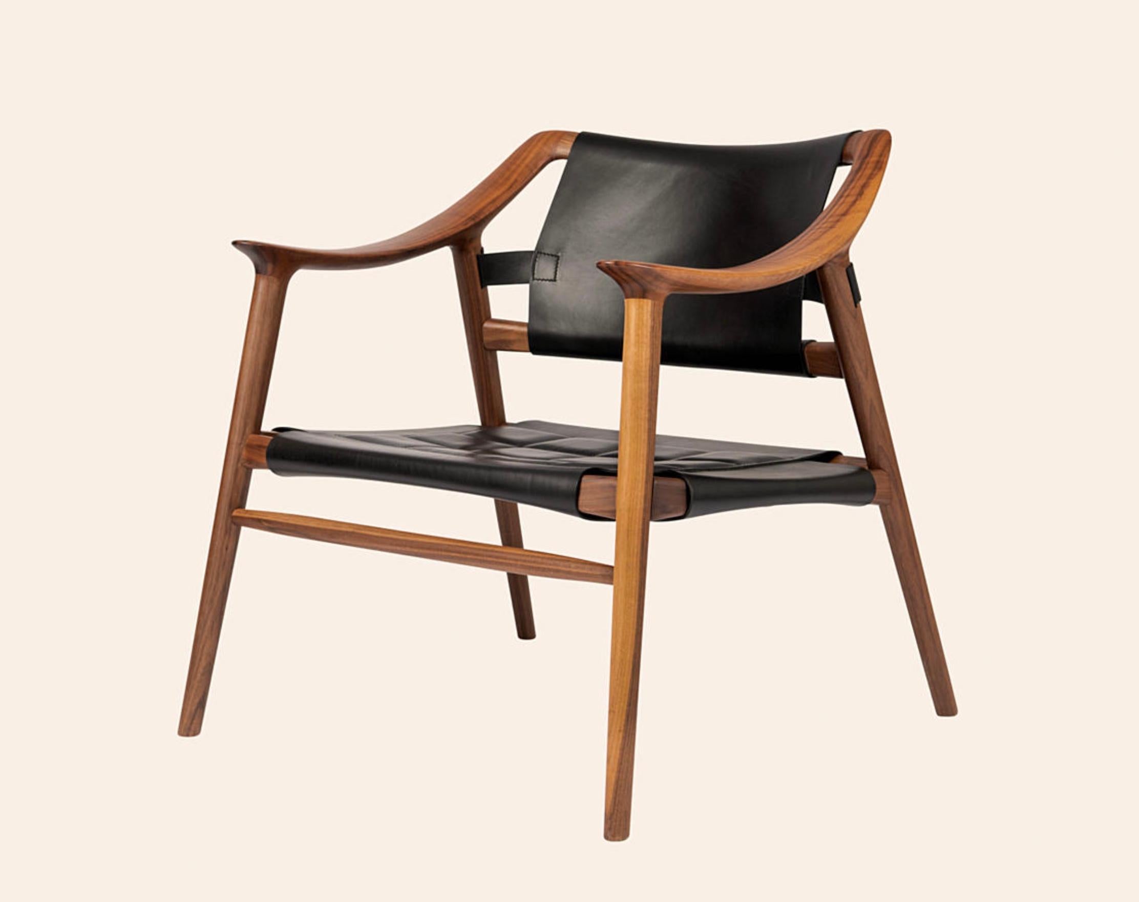 Rastad & Relling 'Bambi' 56/2 Lounge Chair in Solid Walnut for Fjordfiesta. Designed in 1956. New, current production.

Lounge chair in solid walnut or oak with a seat and back in embroidered leather.

The Bambi Lounge chair – an epitome of