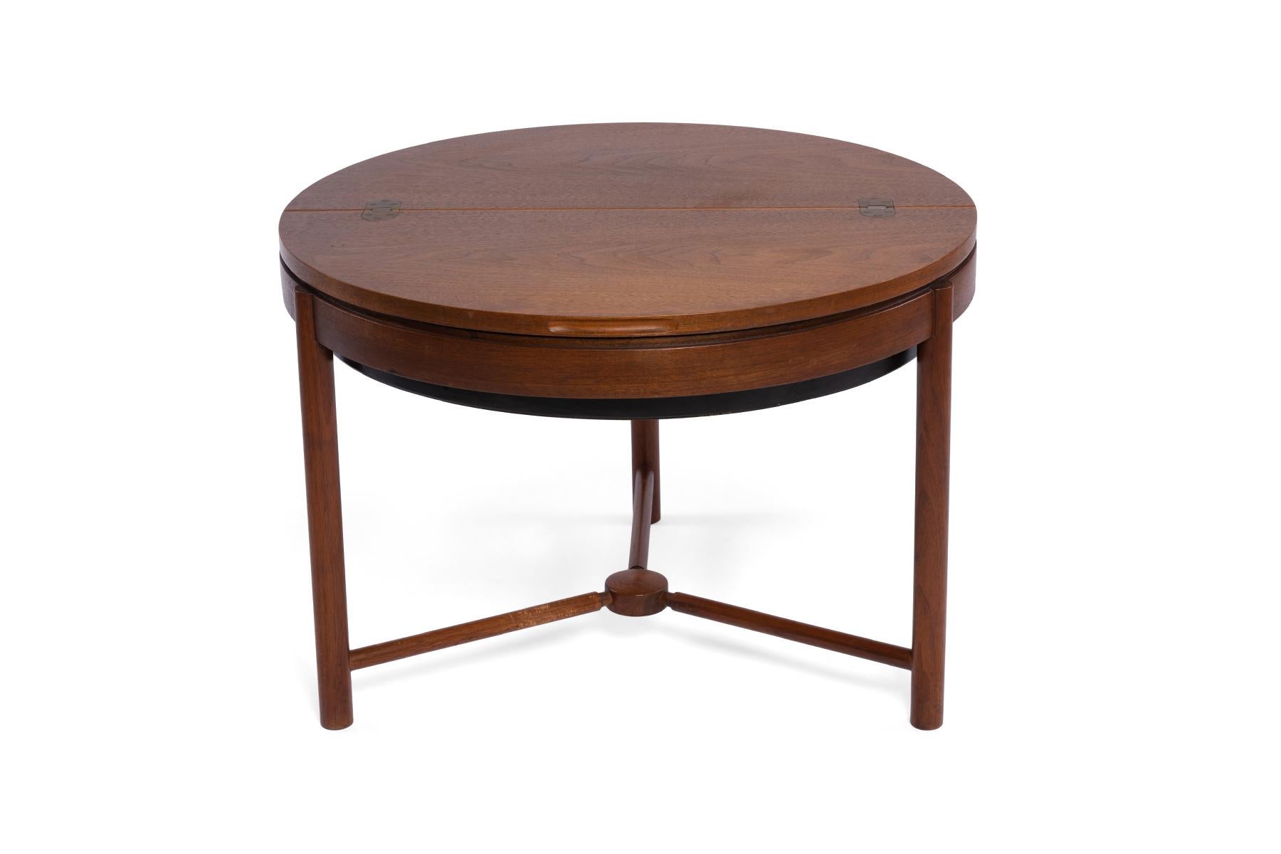 All original sewing table in teak by Rastad and Rellling. This fun example that can be used as a side or occasional table has a divided interior compartment that swivels. The design won the Norwegian Design Competition in 1962.