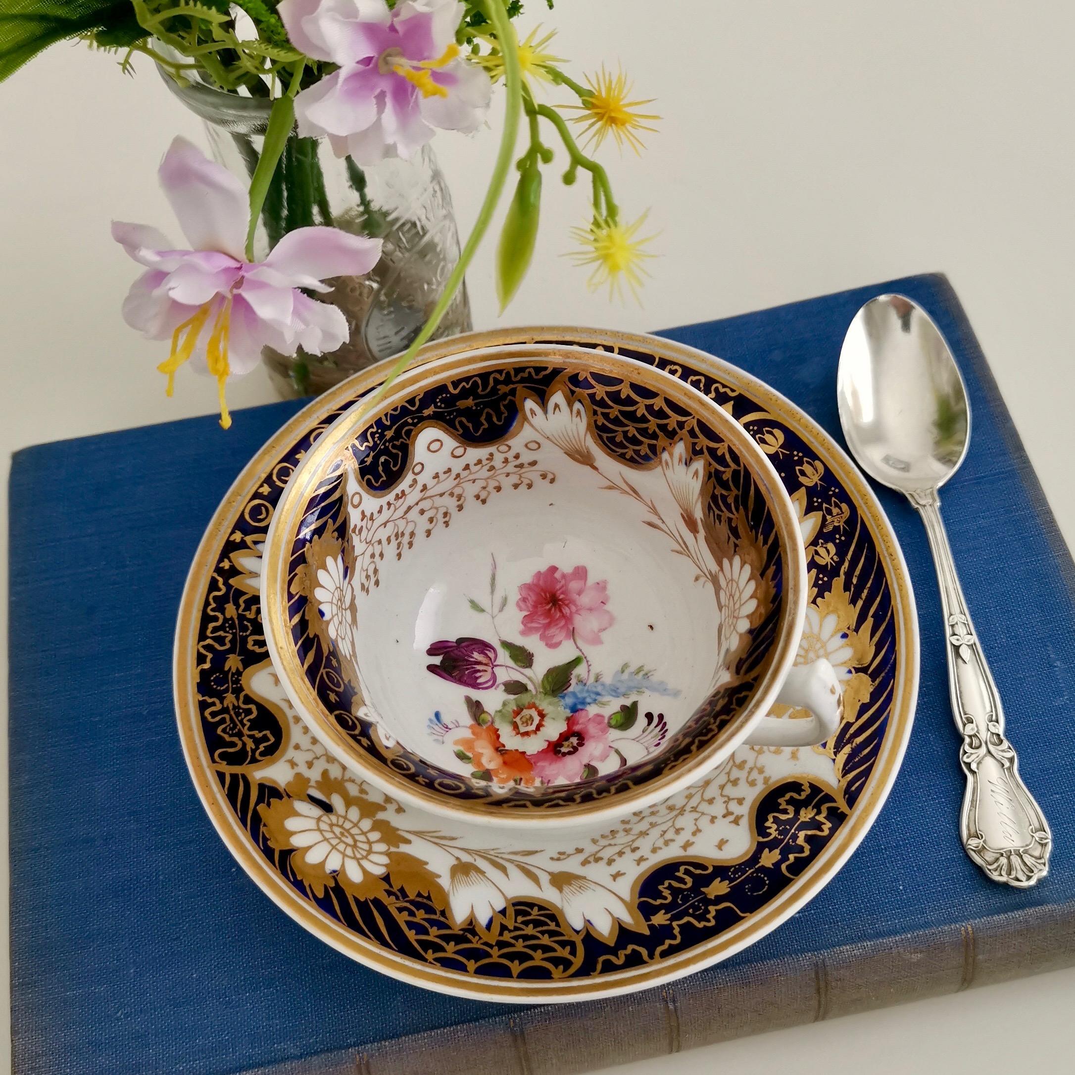This is an exquisitely decorated teacup and saucer made by Rathbone circa 1815, which was the Regency era. It has a cobalt blue and gilt design with beautiful hand painted flowers.

Rathbone was one of the many potters in the early 19th century,
