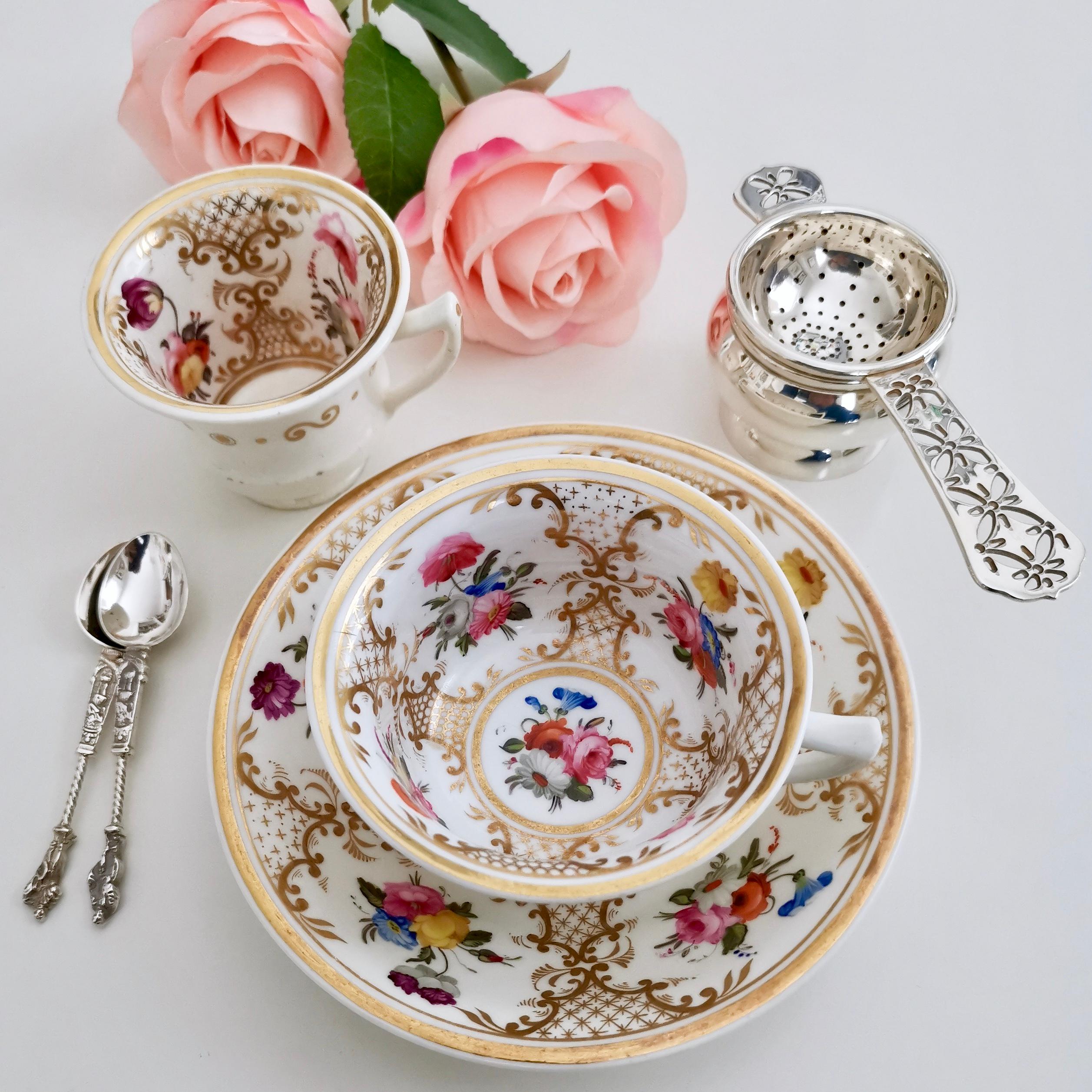 This is an exquisitely decorated trio made by Rathbone circa 1820. Tea and coffee cups were sold sharing one saucer in the early 19th century - as you wouldn't drink tea and coffee at the same time, why would you invest in an extra saucer?

This