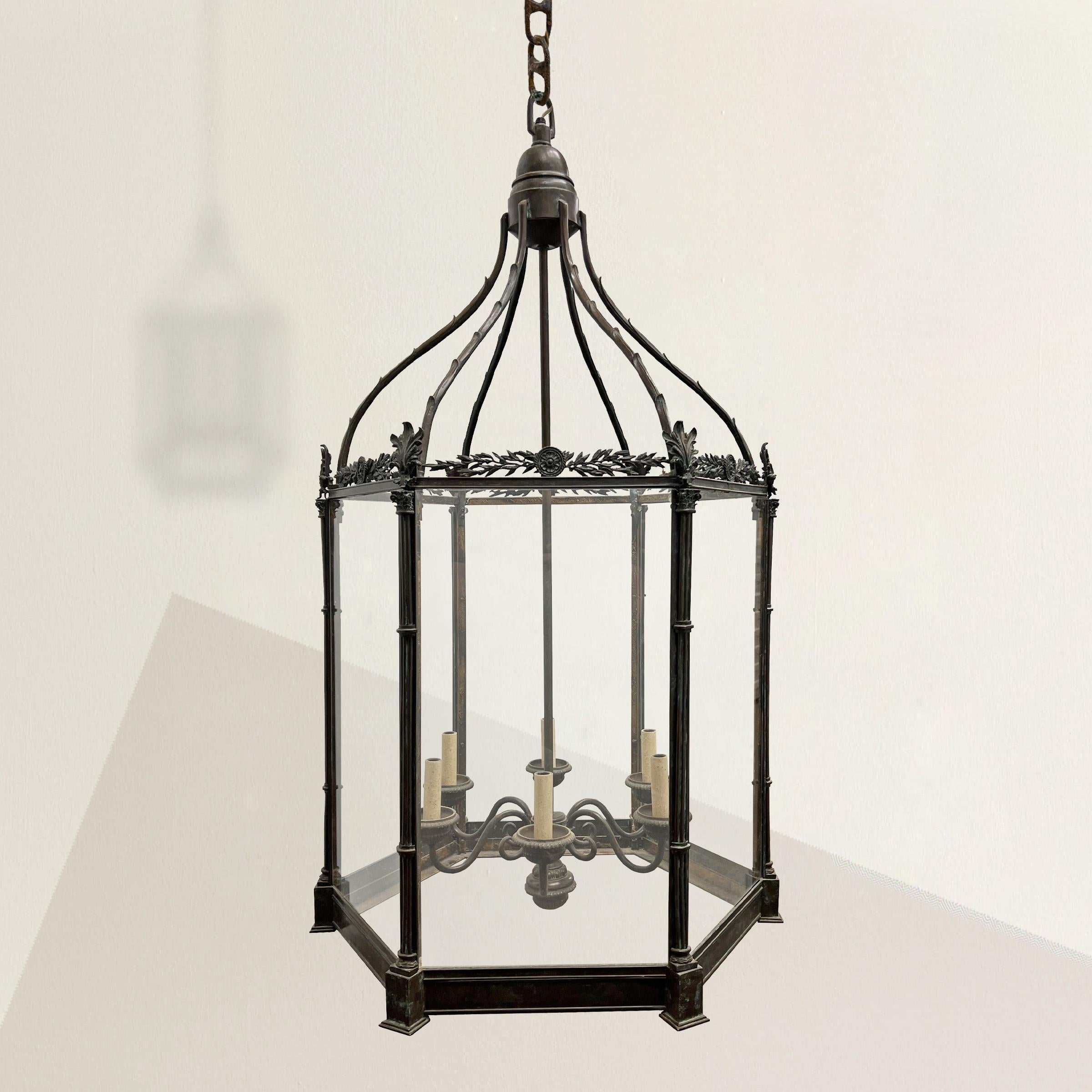 Step back in time to the elegant era of Regency England with this exquisite 20th century bronze lantern, a tribute to the refined tastes and architectural splendor of the period. Inspired by the visionary designs of renowned Regency architects, this